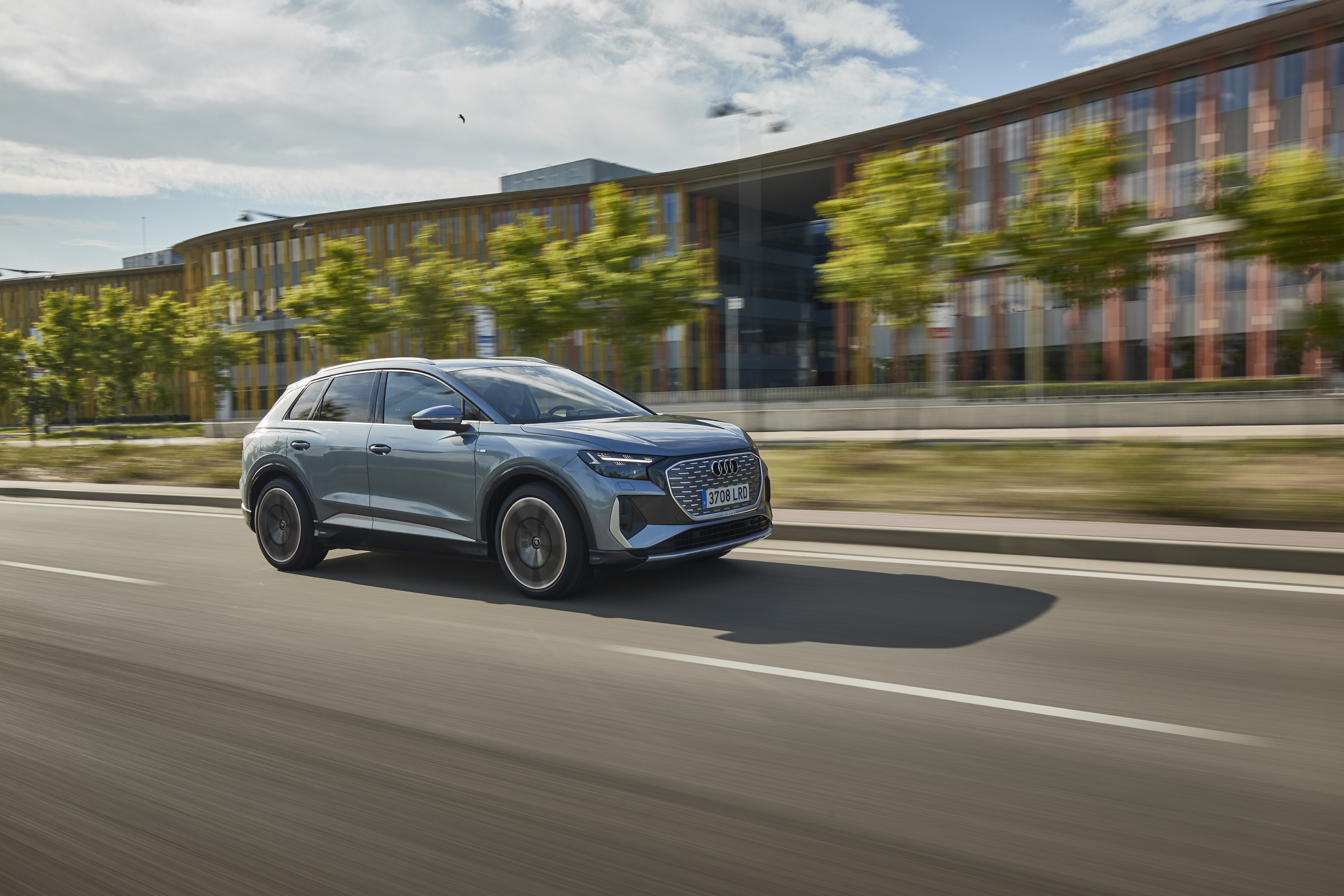 2021 Audi Q4 e-tron electric SUV driving HD Wallpaper
