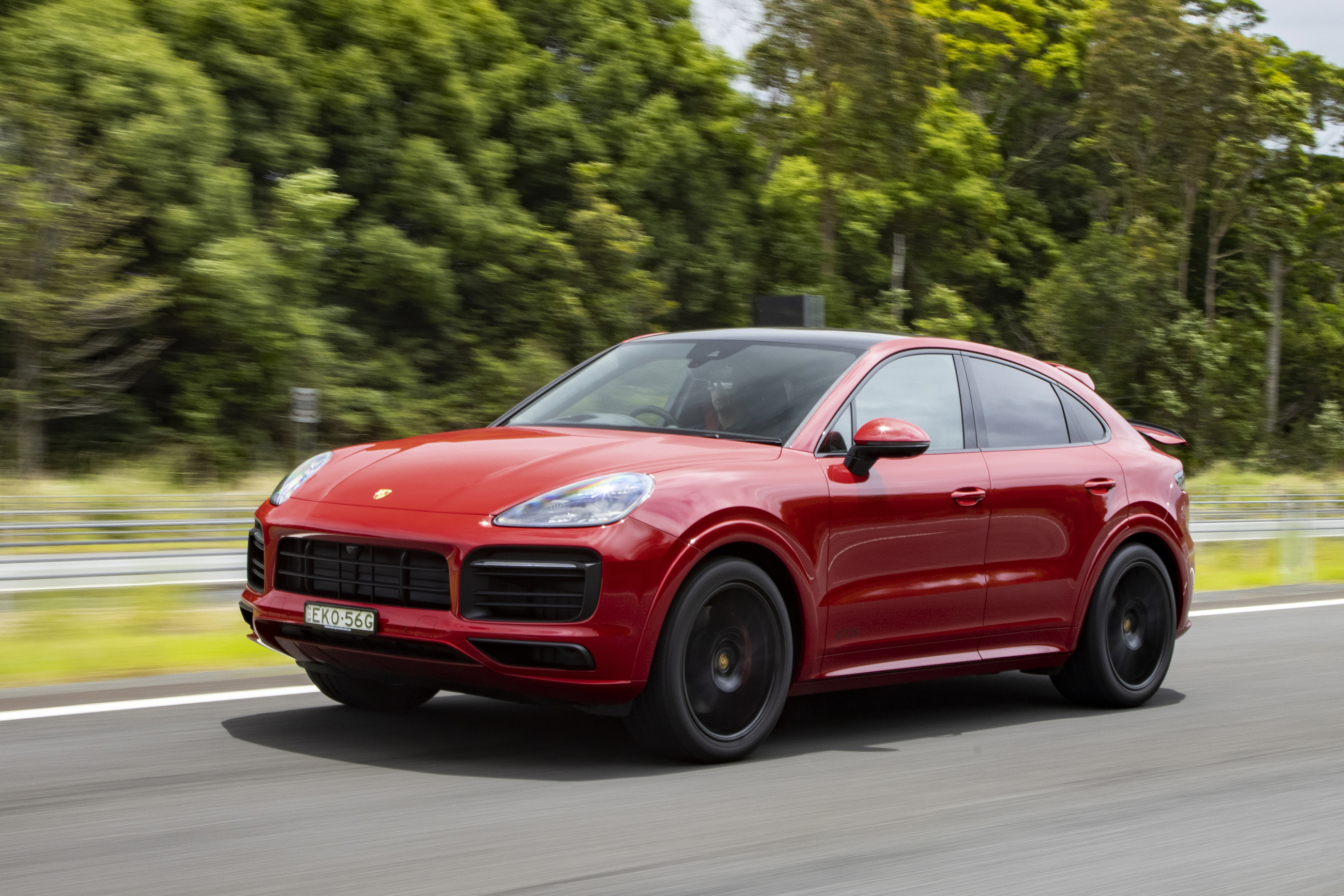 Red Porsche Cayenne GTS Coupé luxury SUV on road HD Wallpaper