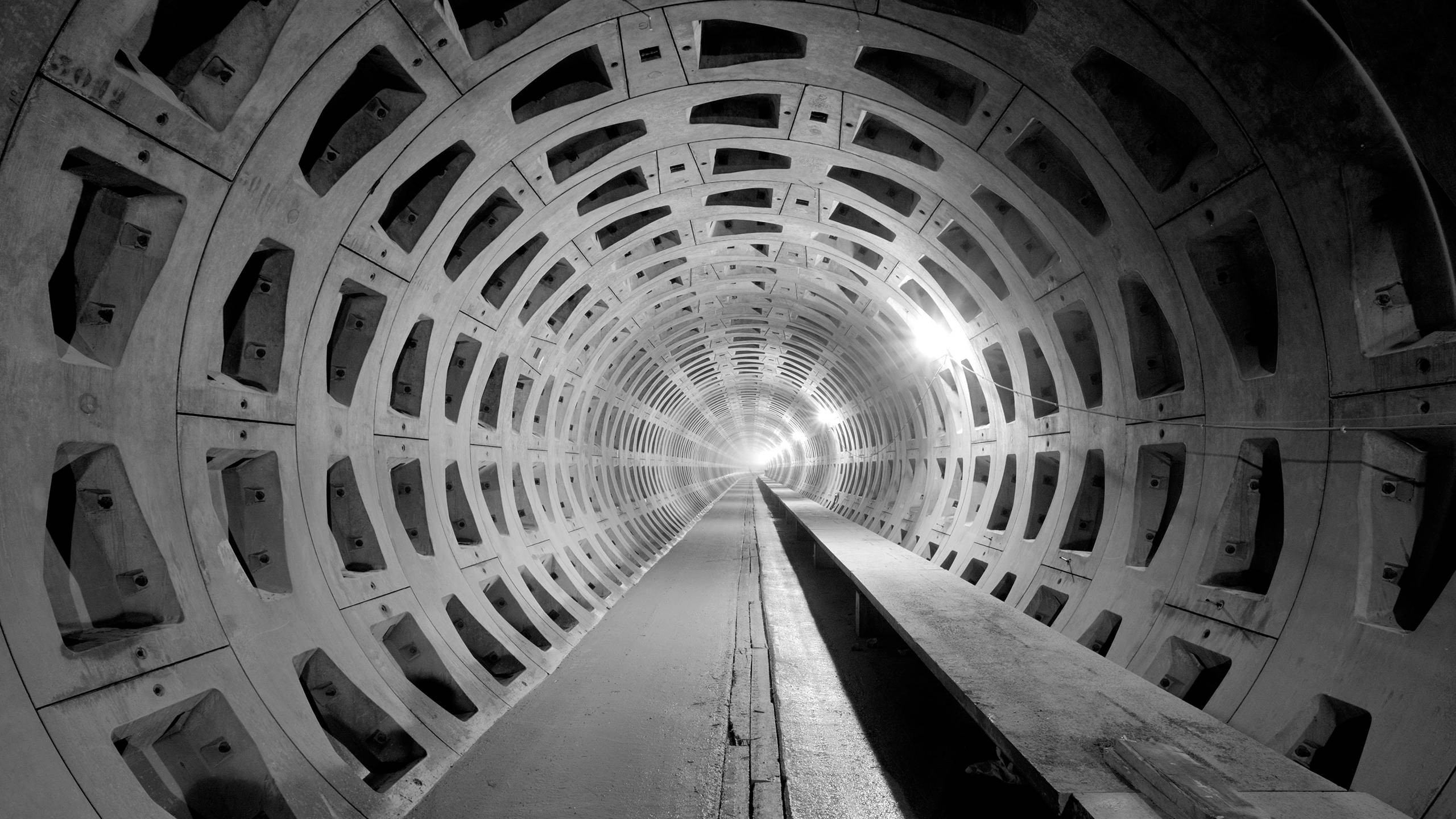 Long Ribbed Tunnel with Light at the End HD Wallpaper