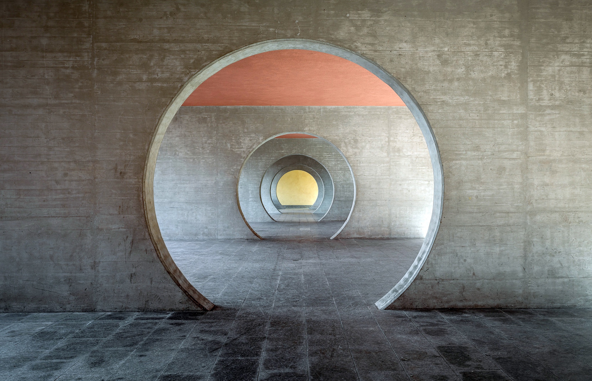 Concrete Circular Tunnels with Red and Yellow Light HD Wallpaper