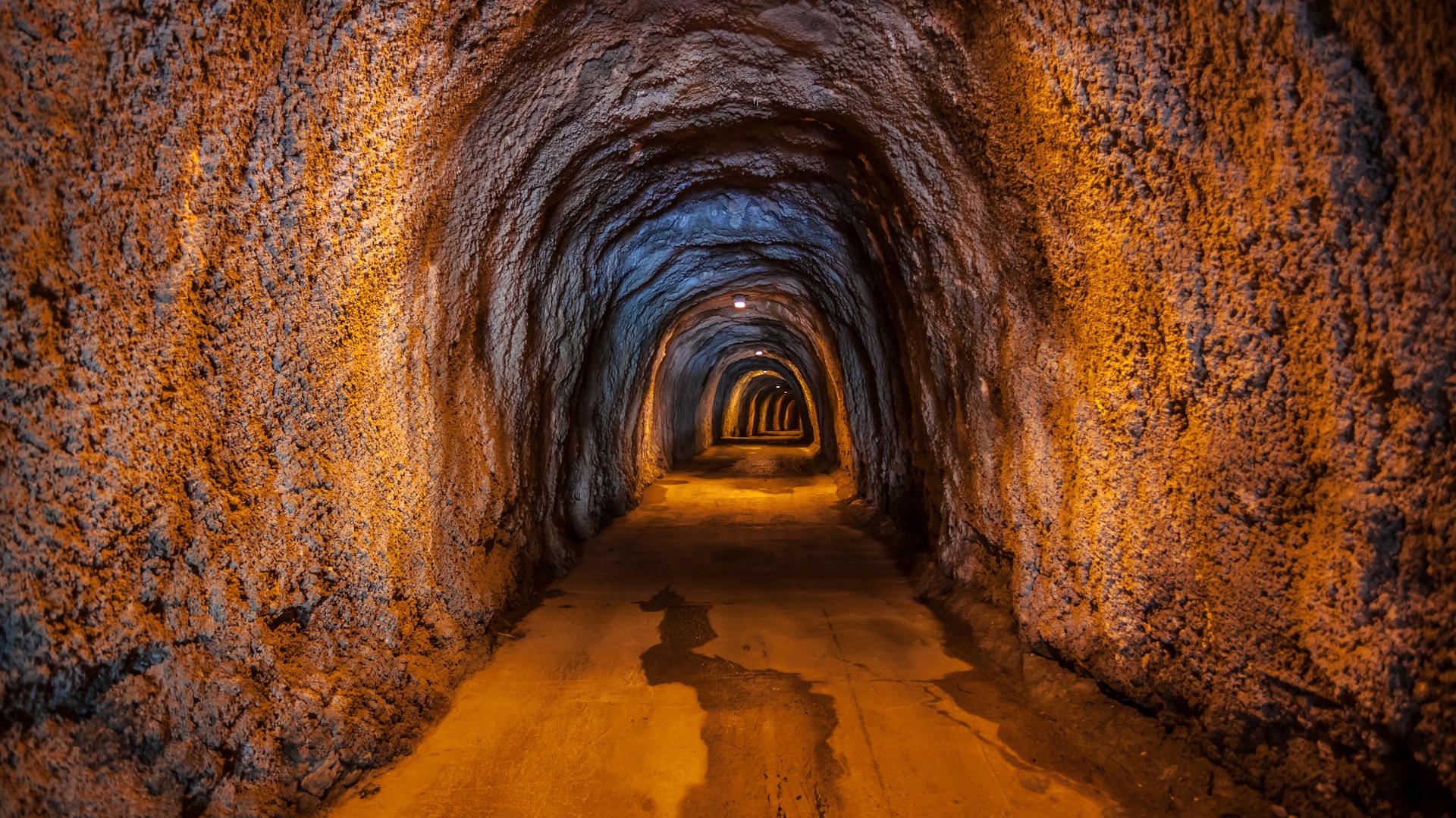 Warmly Lit Cave Tunnel Interior HD Wallpaper