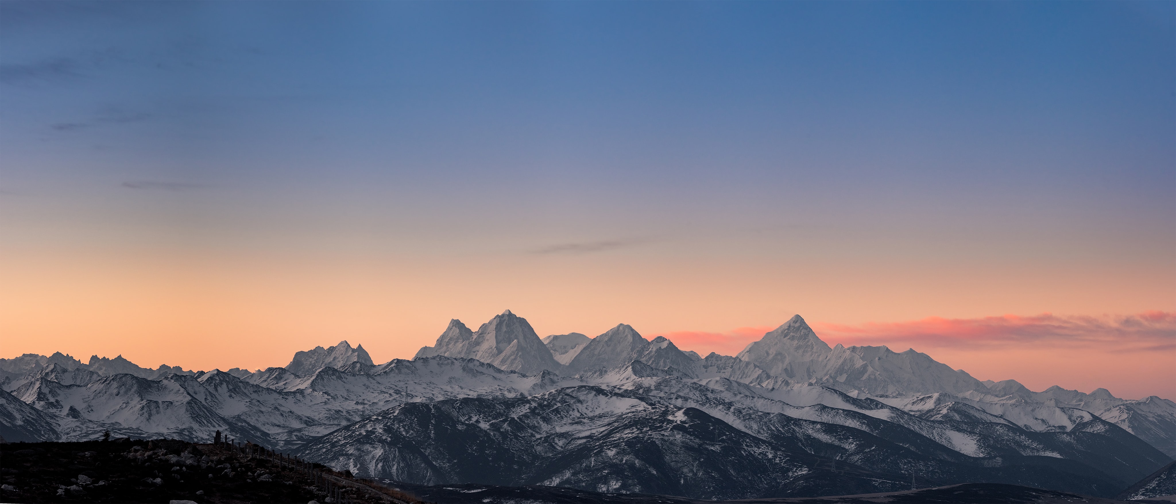 Panoramic snow-capped mountains at sunrise HD Wallpaper