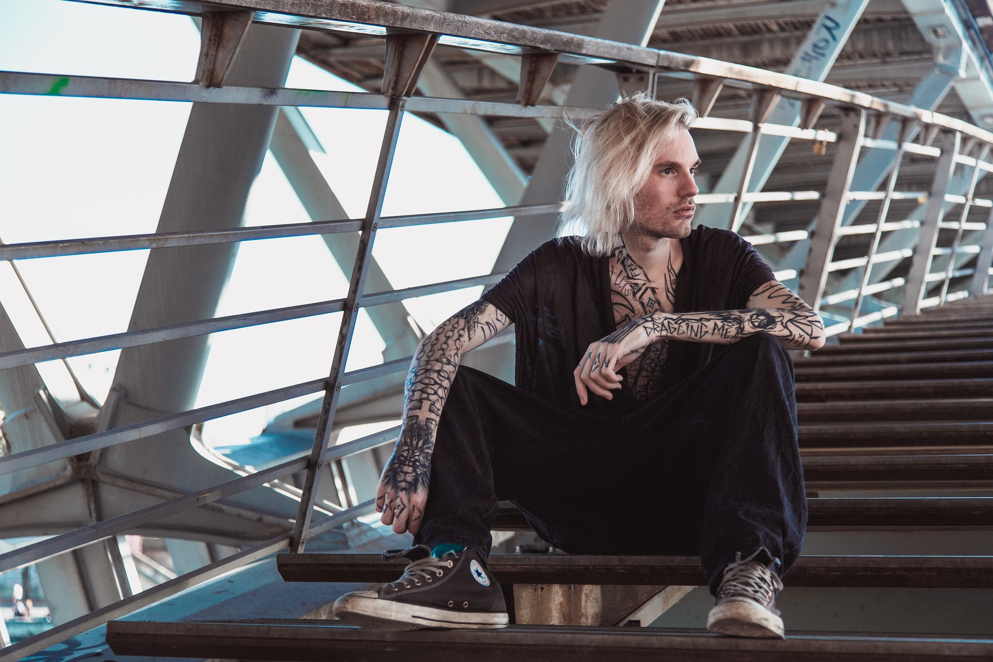 Blonde tattooed model sitting on bridge stairs HD Wallpaper