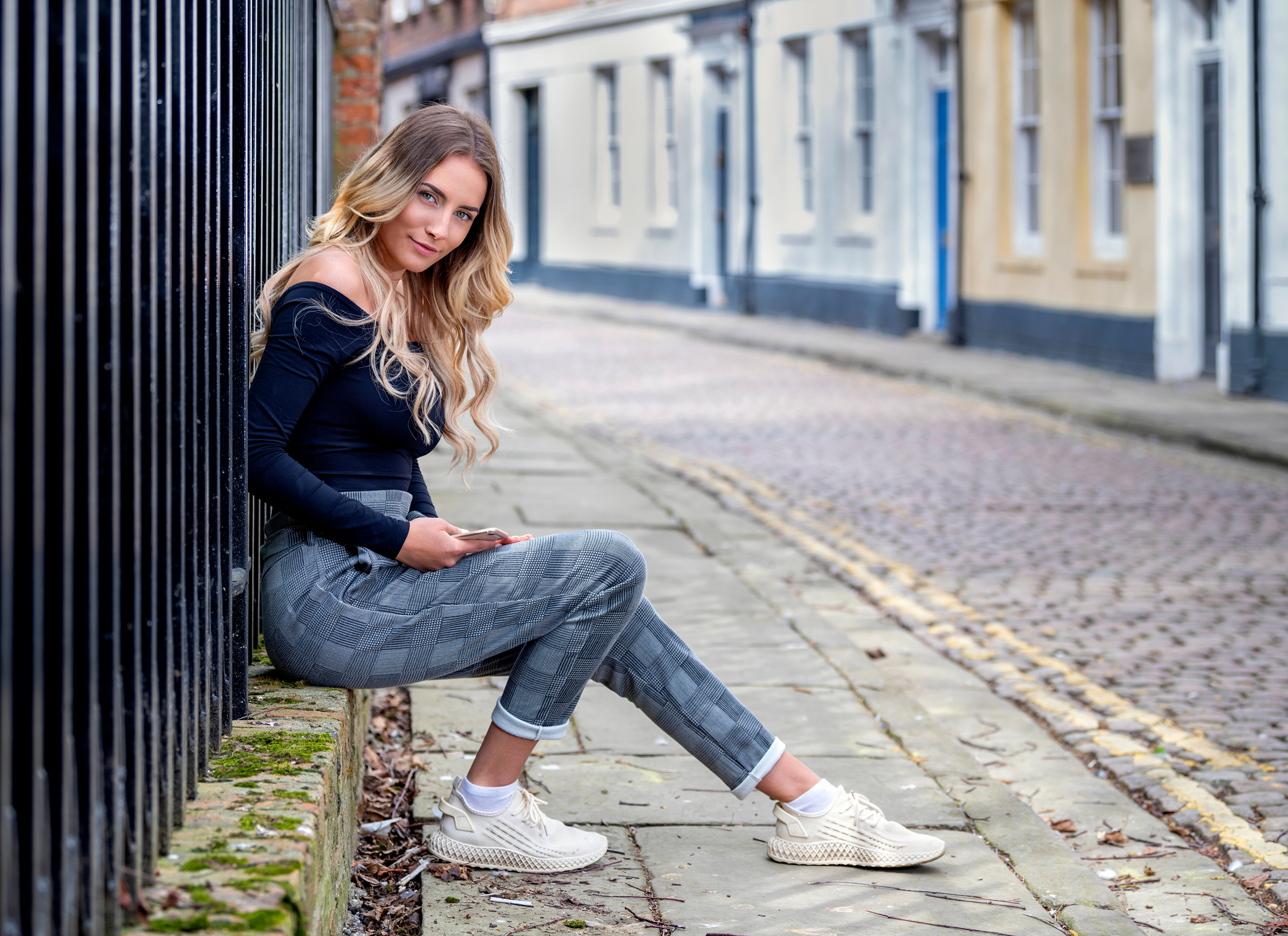 Blonde Model Sitting on Sidewalk in 4K HD Wallpaper