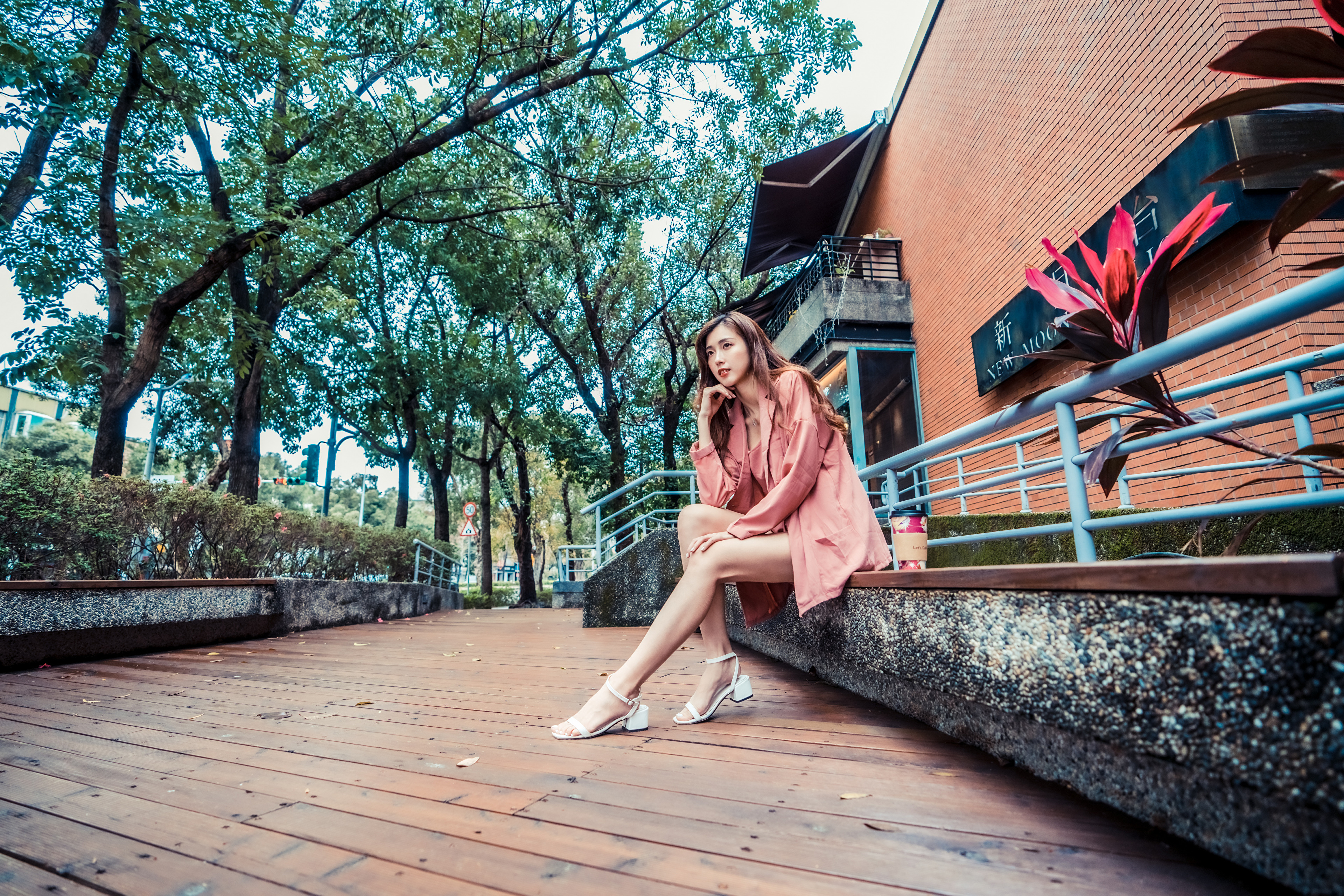 Asian Model in Casual Outdoor Setting 4K HD Wallpaper