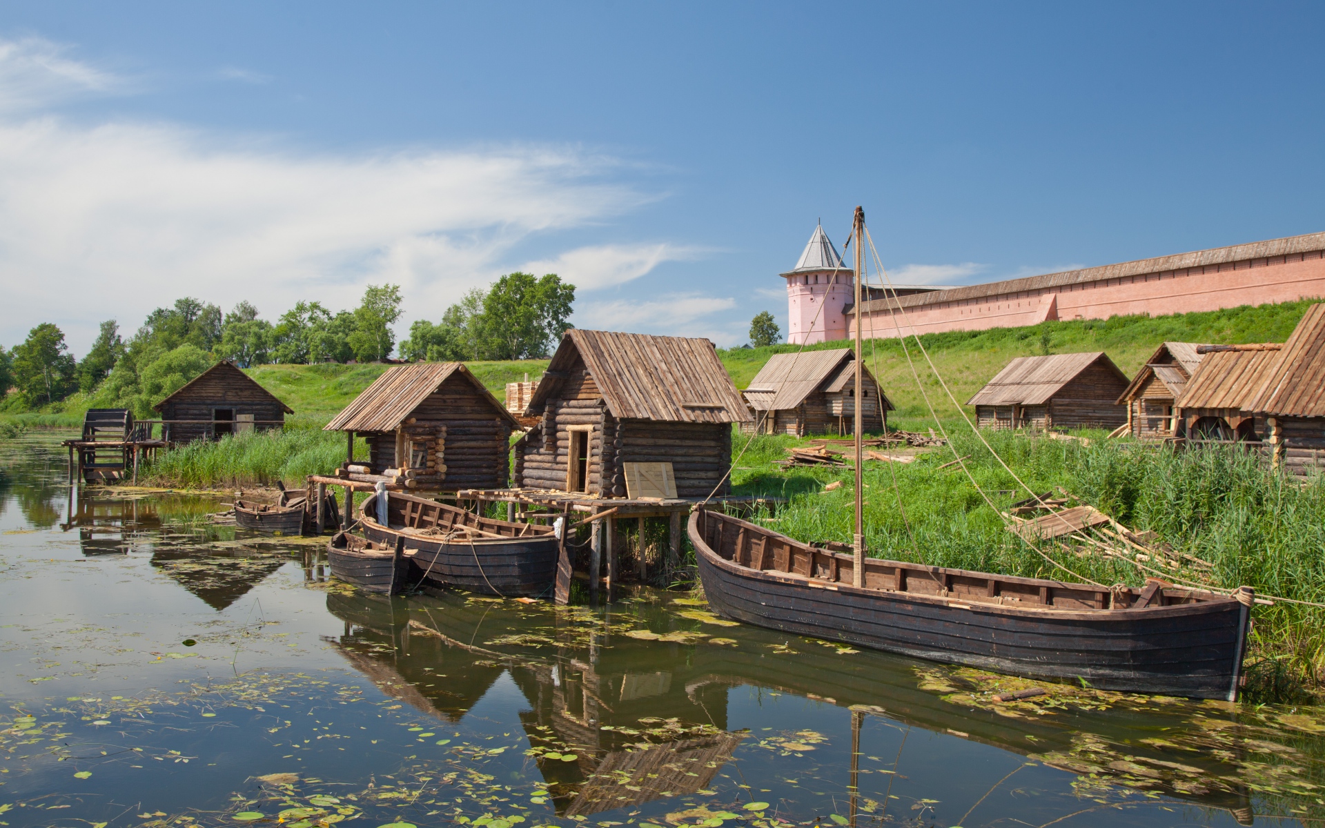 Suzdal river village with traditional boats and monastery HD Wallpaper