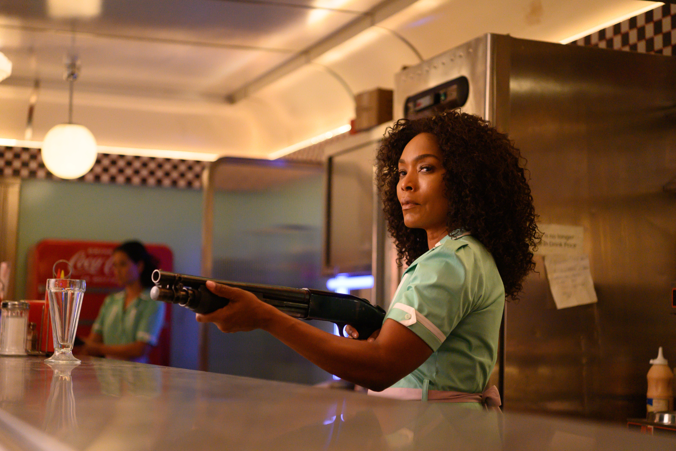 Angela Bassett with shotgun in Gunpowder Milkshake HD Wallpaper