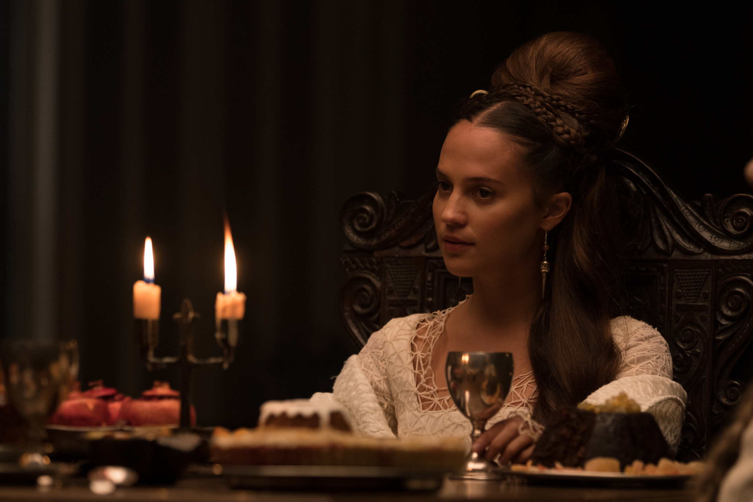 Alicia Vikander as Lady at a candlelit dinner in The Green Knight HD Wallpaper