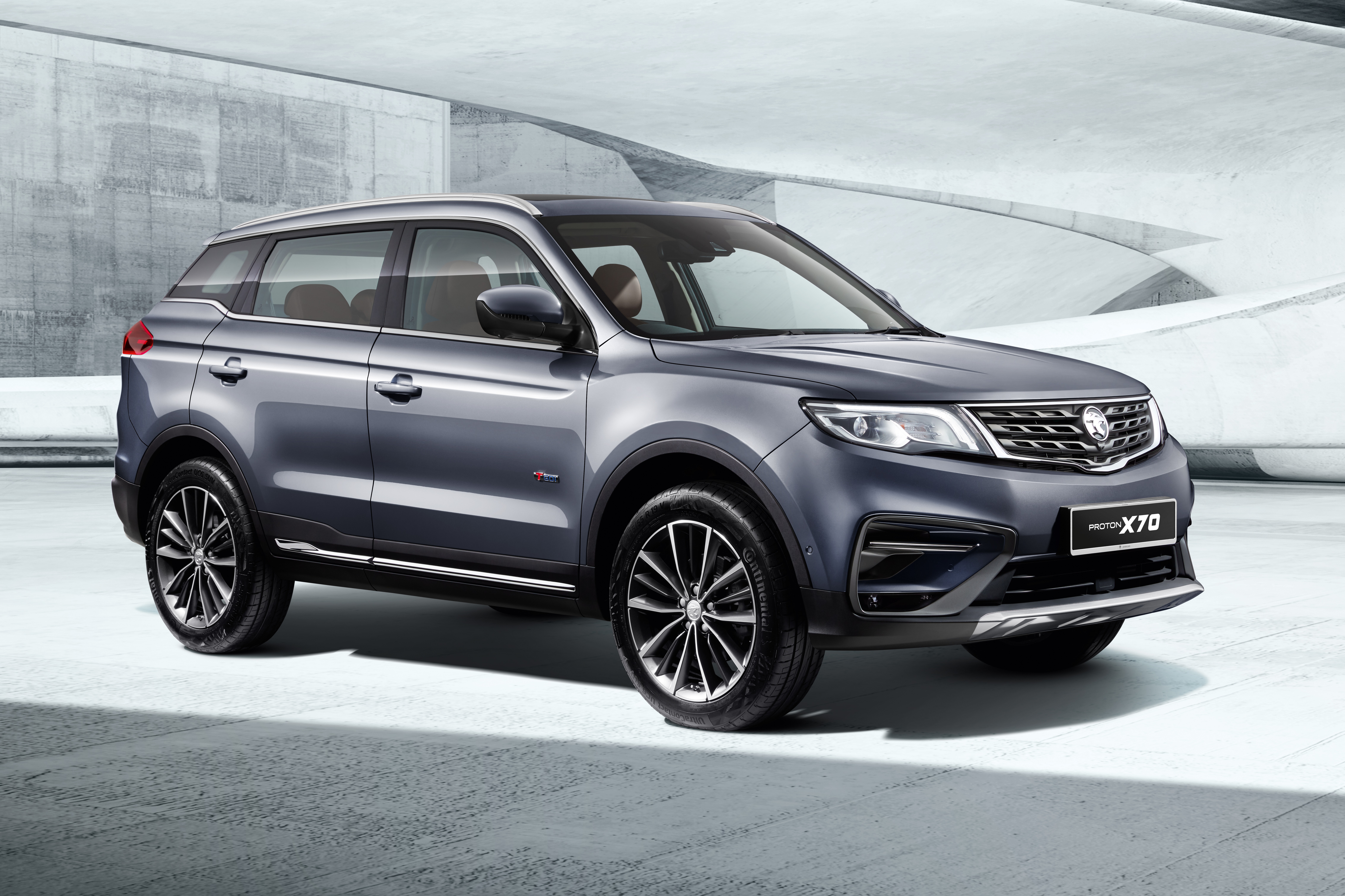 Grey Proton X70 SUV in modern setting HD Wallpaper