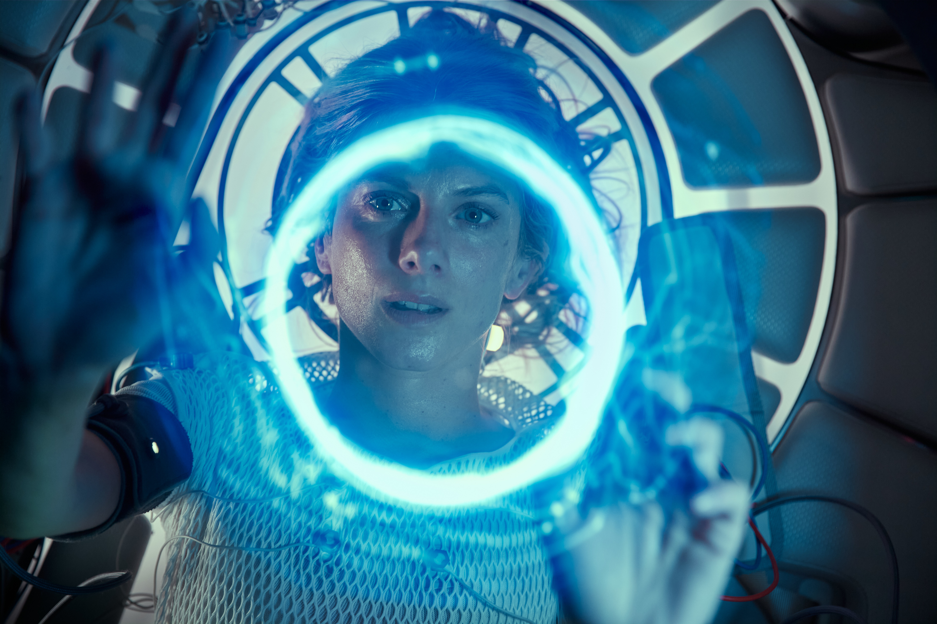 Melanie Laurent with glowing blue interface in Oxygen HD Wallpaper