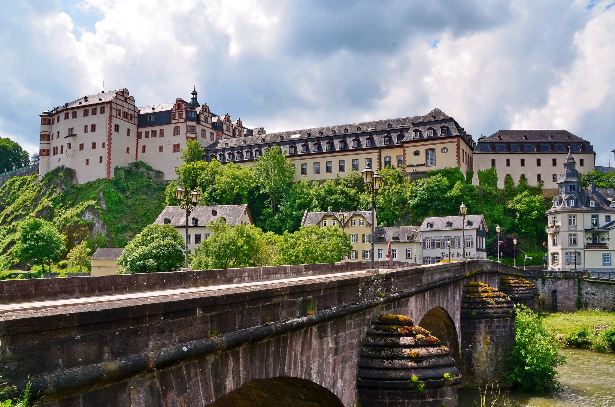 Weilburg Castle and town with historic bridge over river HD Wallpaper