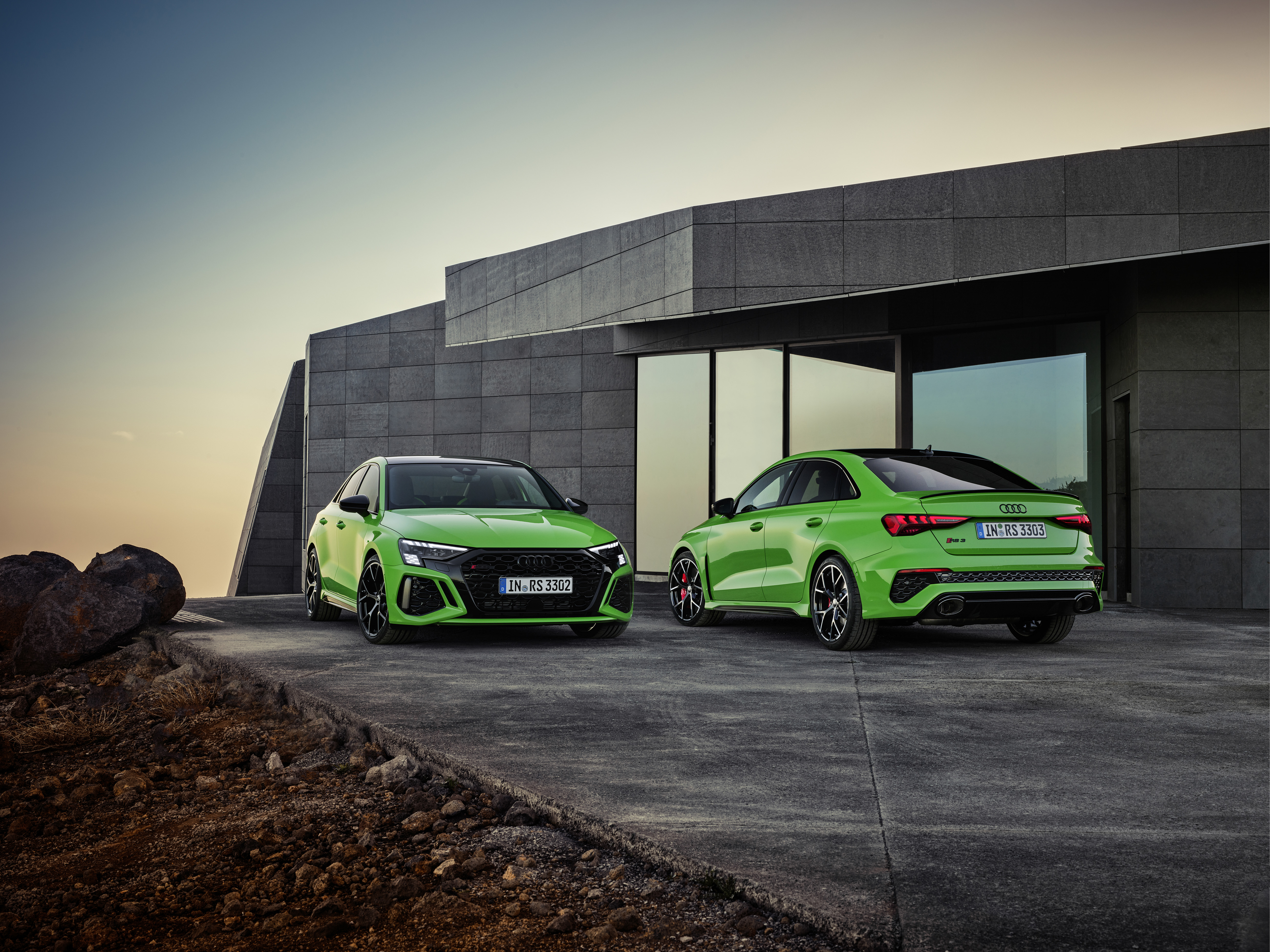 Two Green Audi RS3 Sedans at Sunset HD Wallpaper