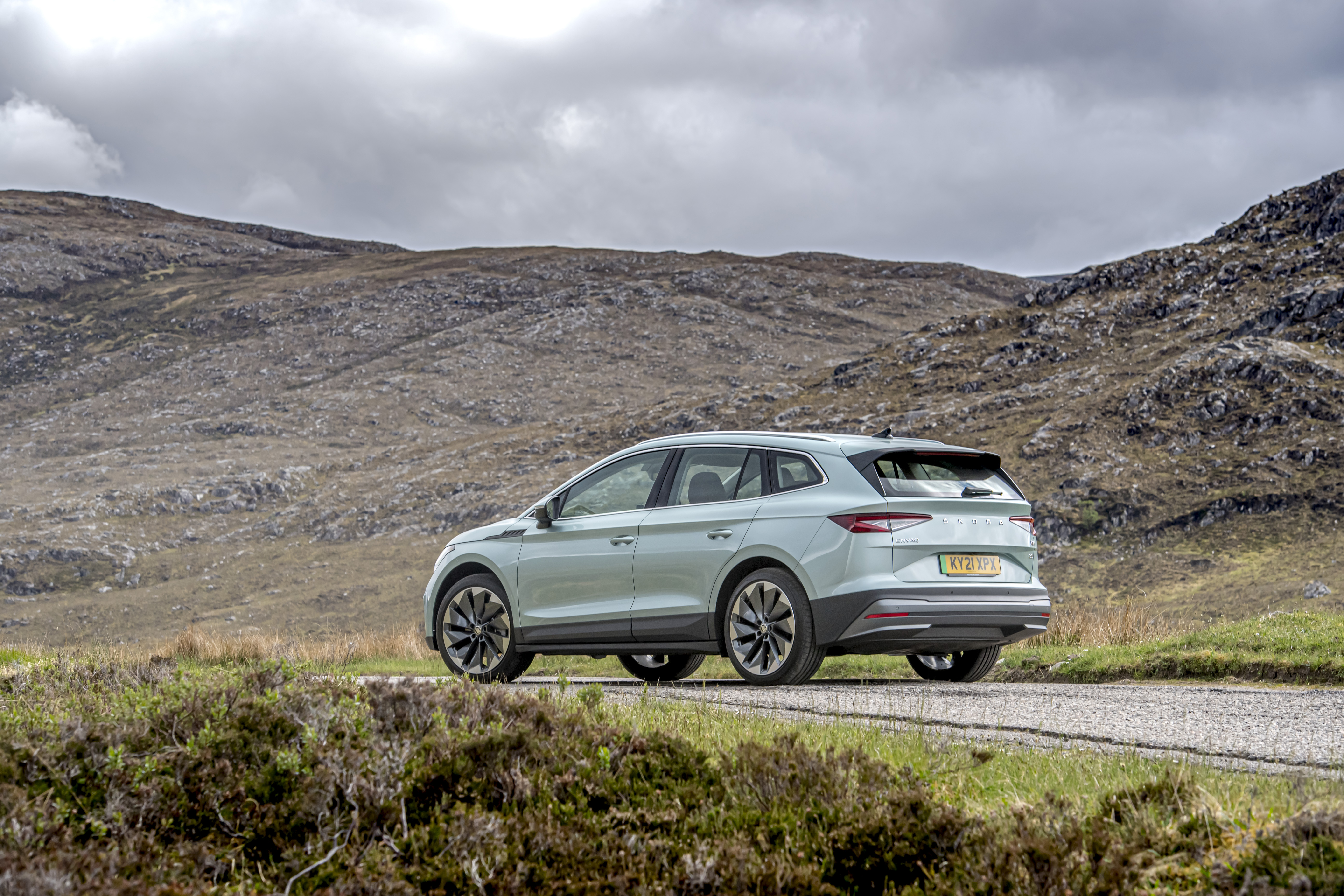 Škoda Enyaq Electric SUV in a rugged landscape HD Wallpaper