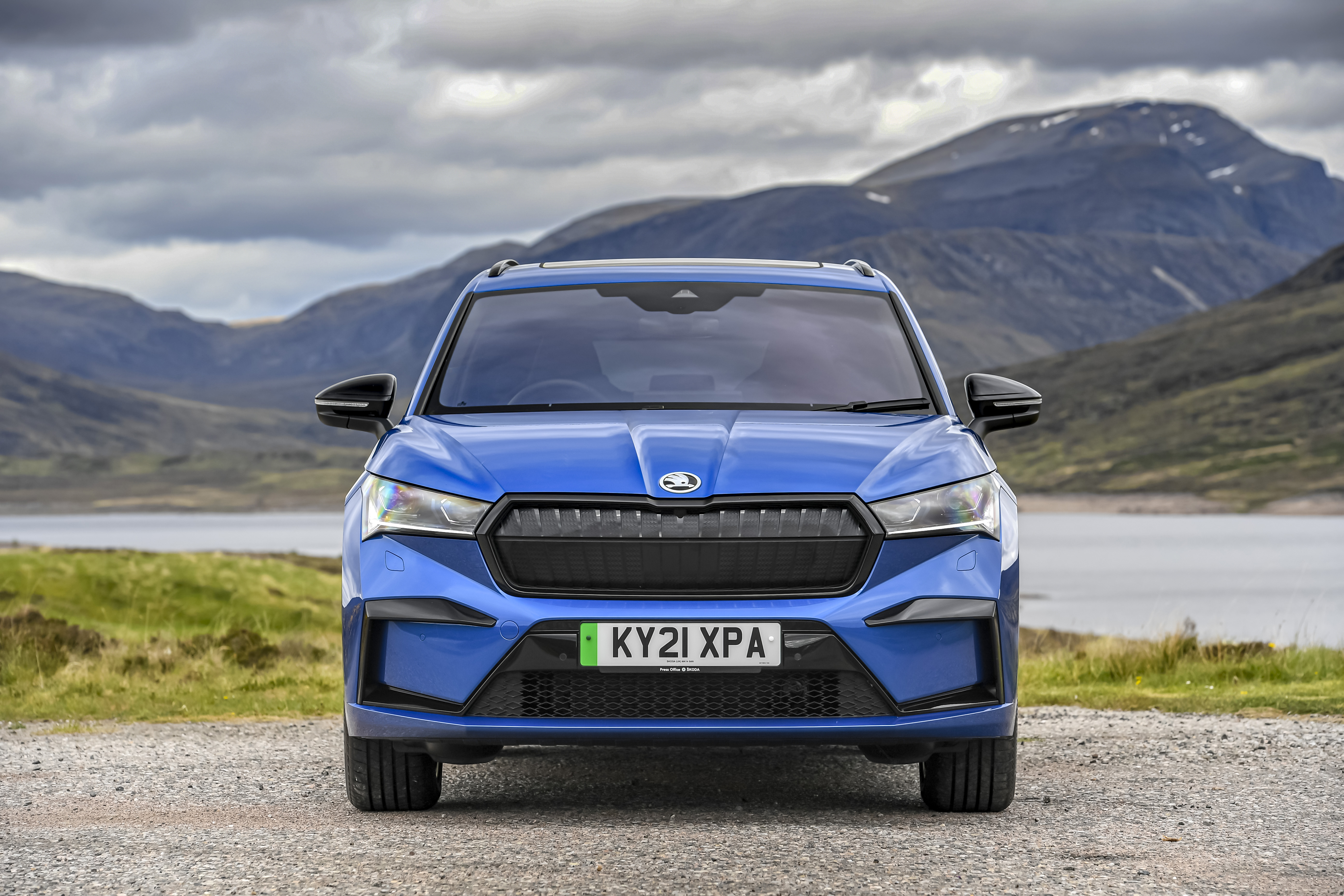 Blue Škoda Enyaq Sportline iV 80 SUV in scenic landscape HD Wallpaper