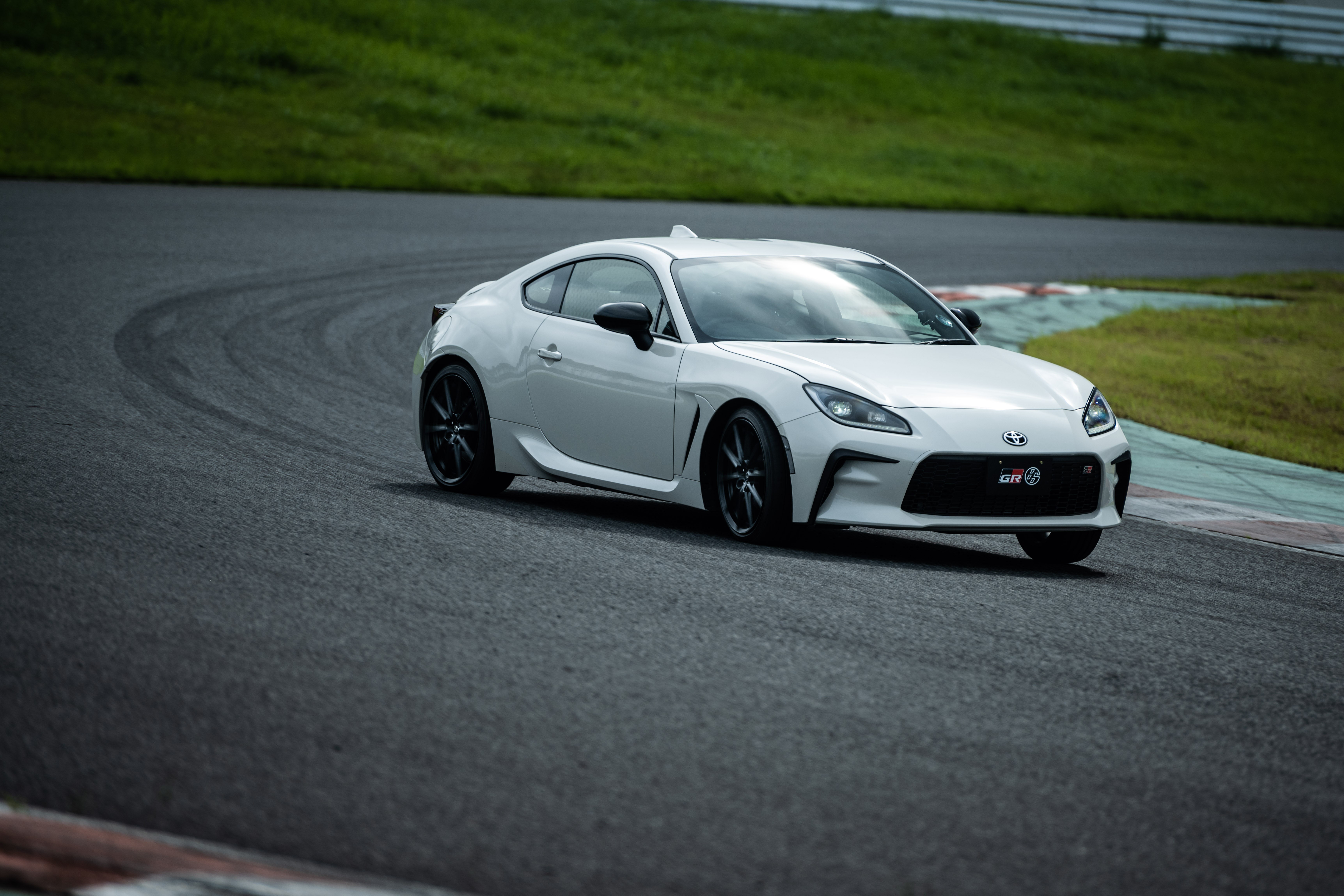 White Toyota GR 86 Sport Car Cornering on Track HD Wallpaper