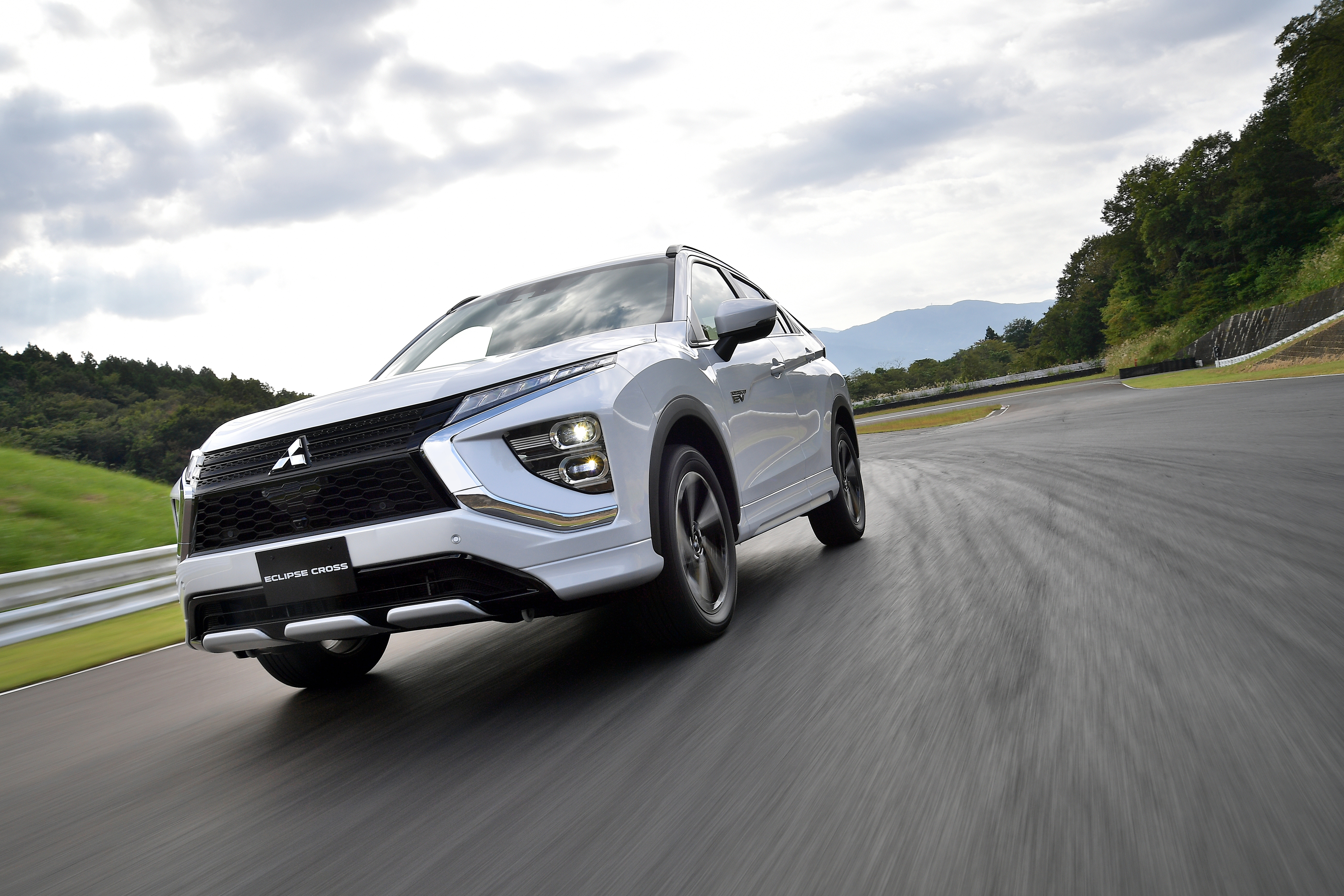 Mitsubishi Eclipse Cross SUV on a race track HD Wallpaper