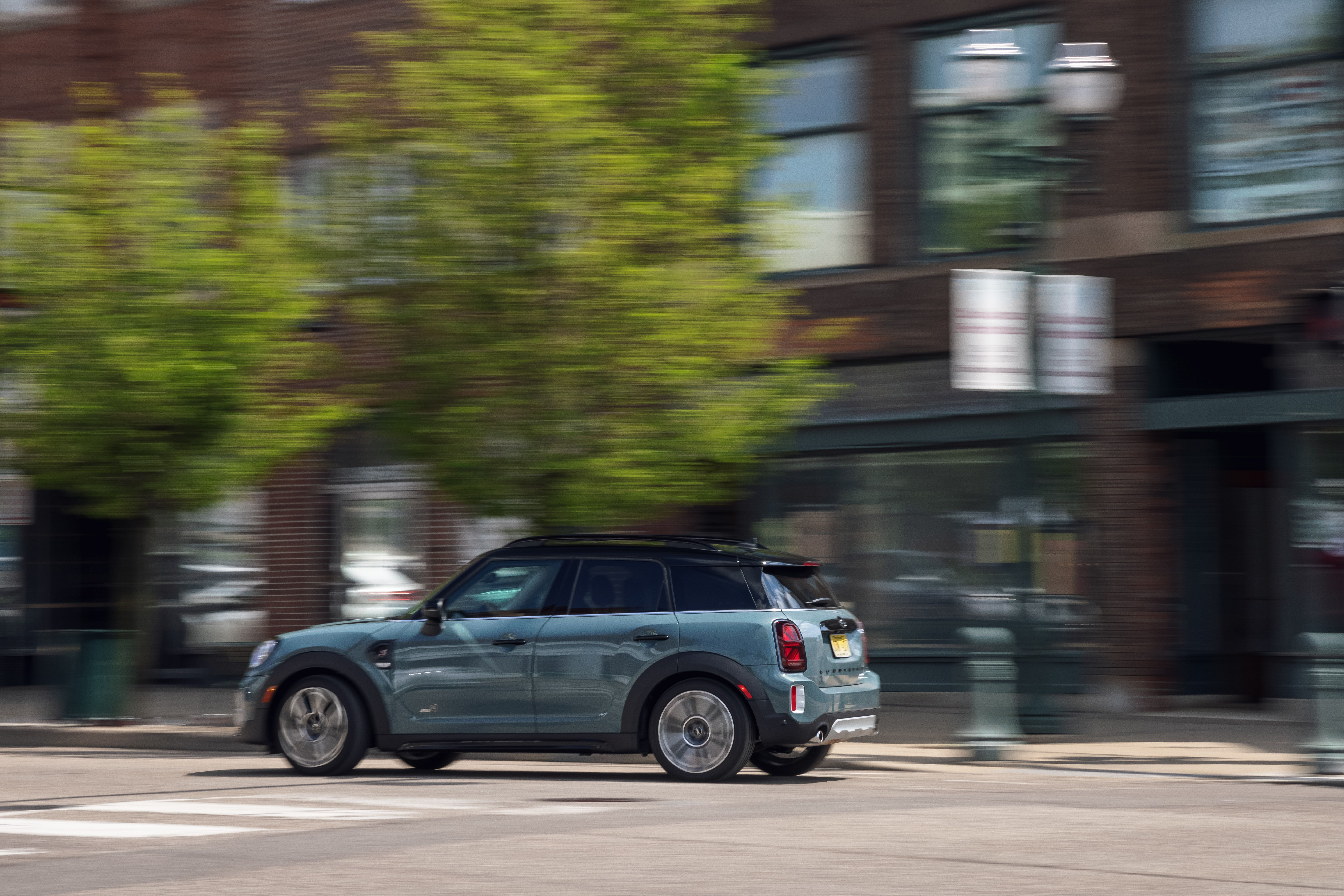 MINI Cooper S Countryman ALL4 driving with motion blur HD Wallpaper