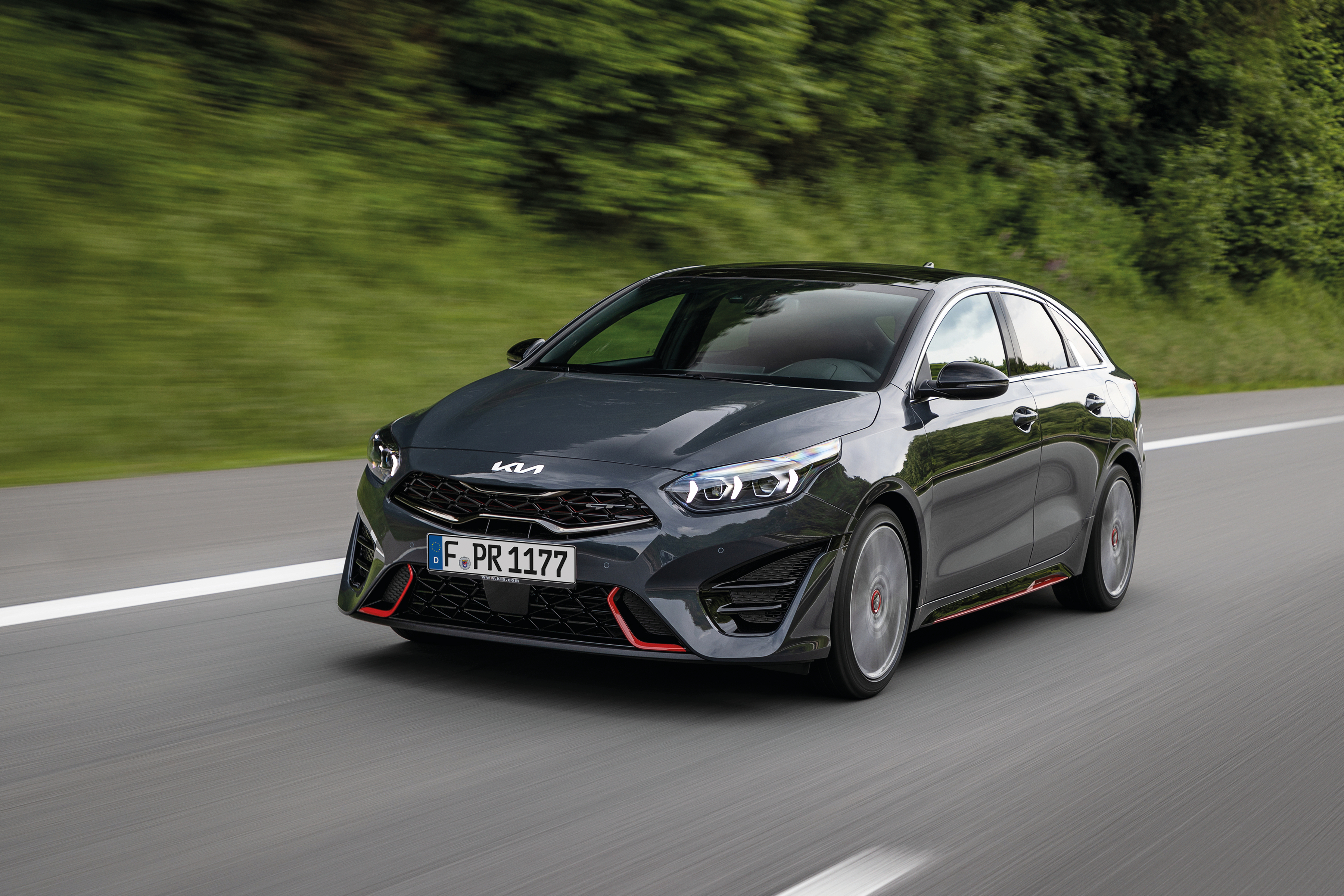 Black 2021 Kia ProCeed GT driving on road HD Wallpaper