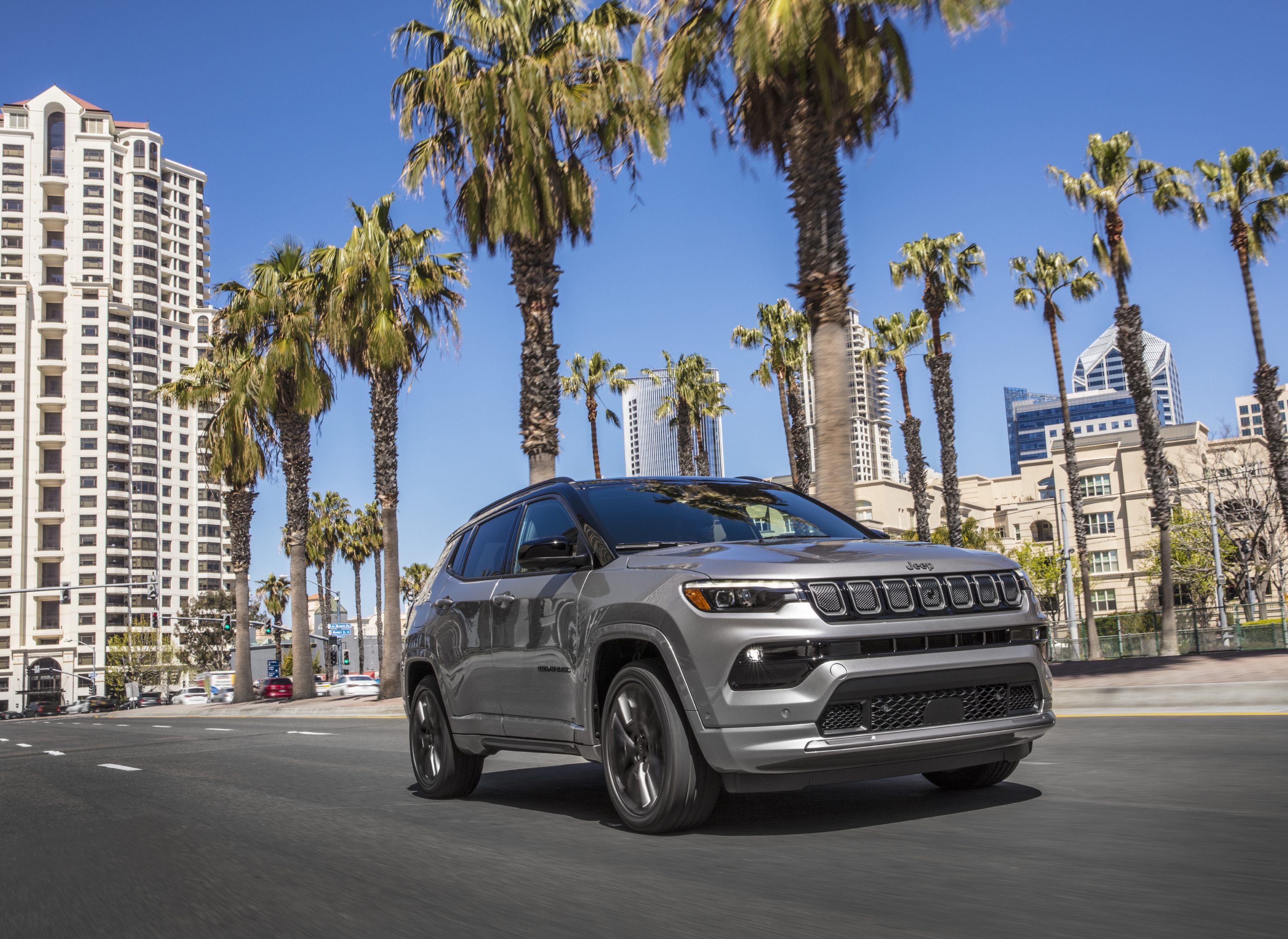 Silver Jeep Compass High Altitude SUV on a city street HD Wallpaper