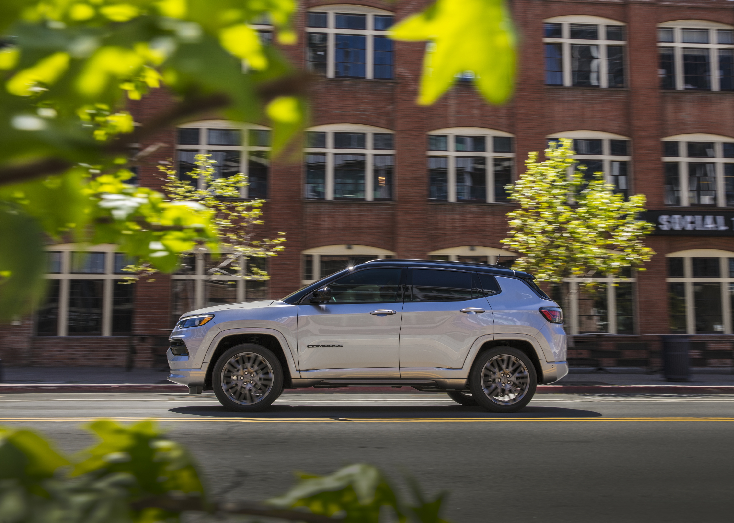 Silver Jeep Compass High Altitude SUV driving on street HD Wallpaper