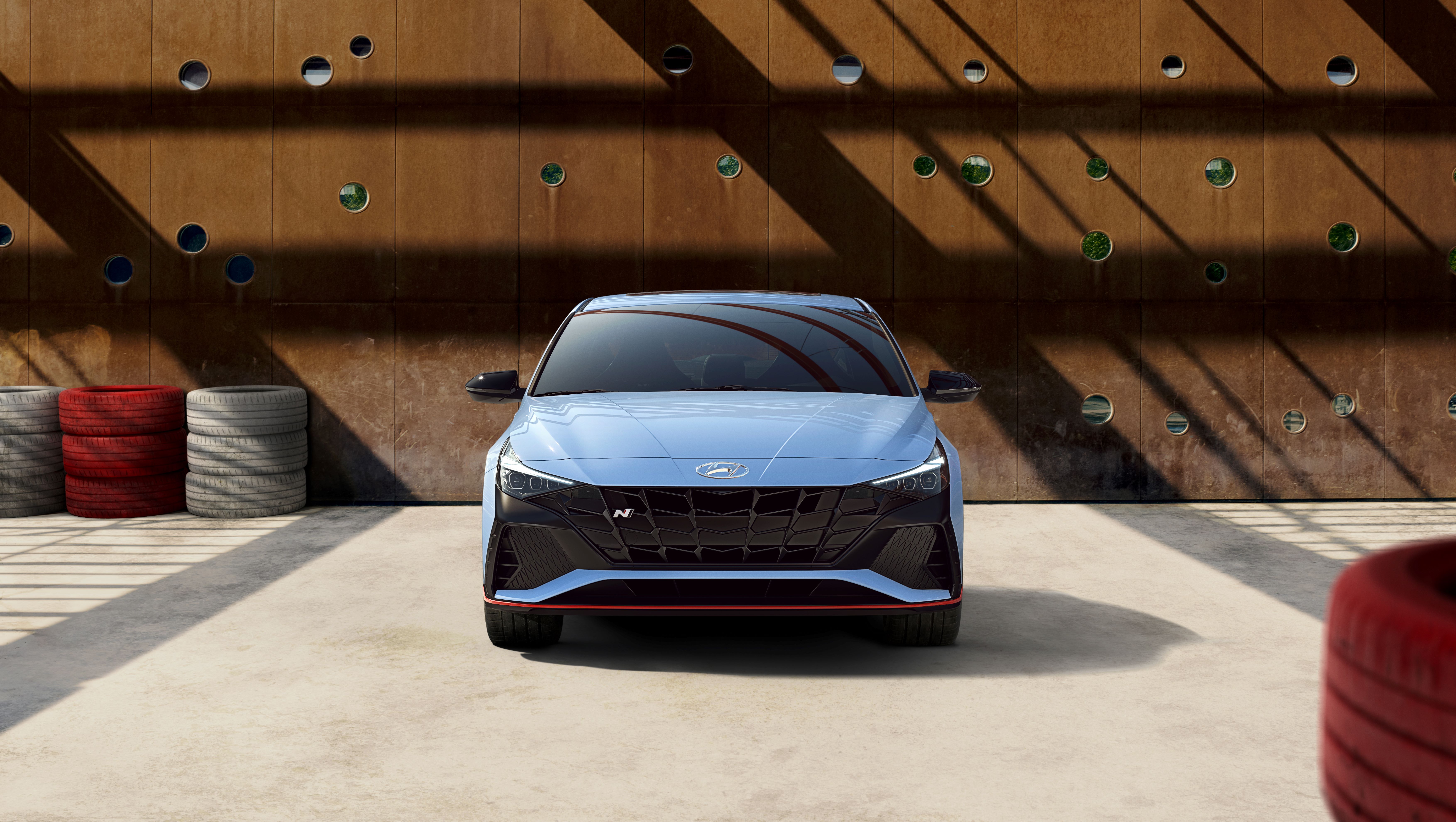 Hyundai Elantra N sport car front view in garage HD Wallpaper