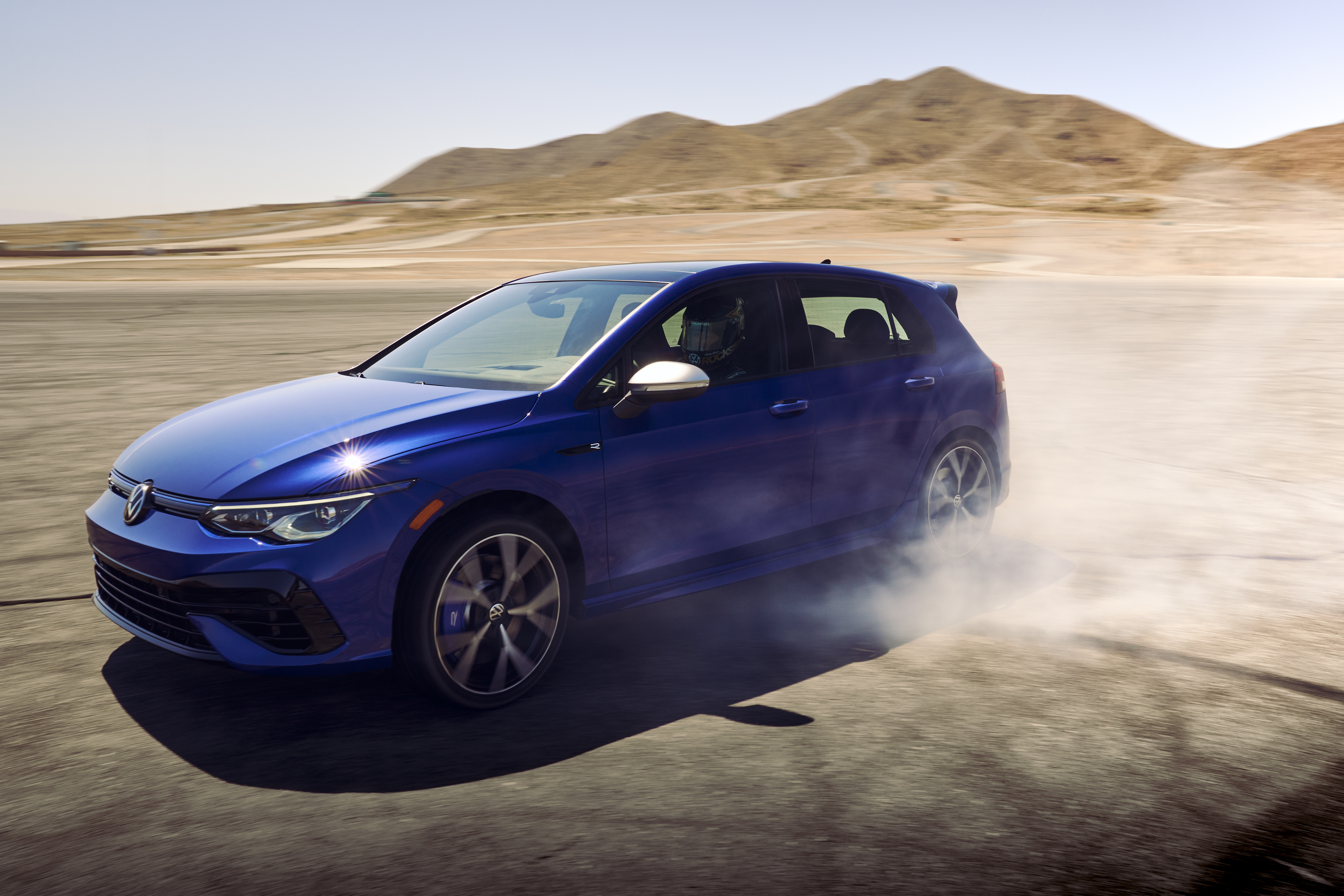 Blue 2022 Volkswagen Golf R drifting on track HD Wallpaper