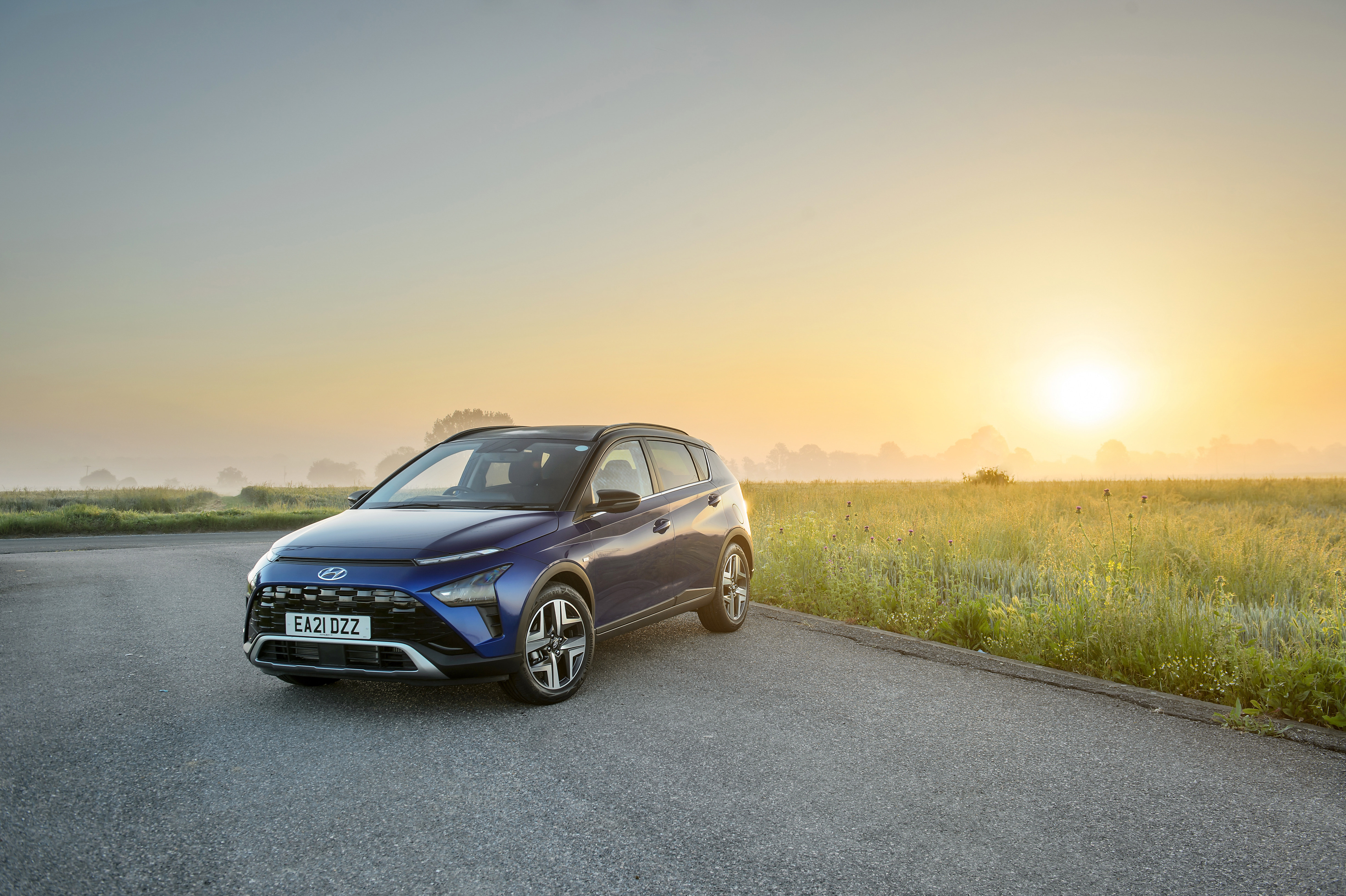 Blue 2021 Hyundai Bayon SUV at sunrise HD Wallpaper