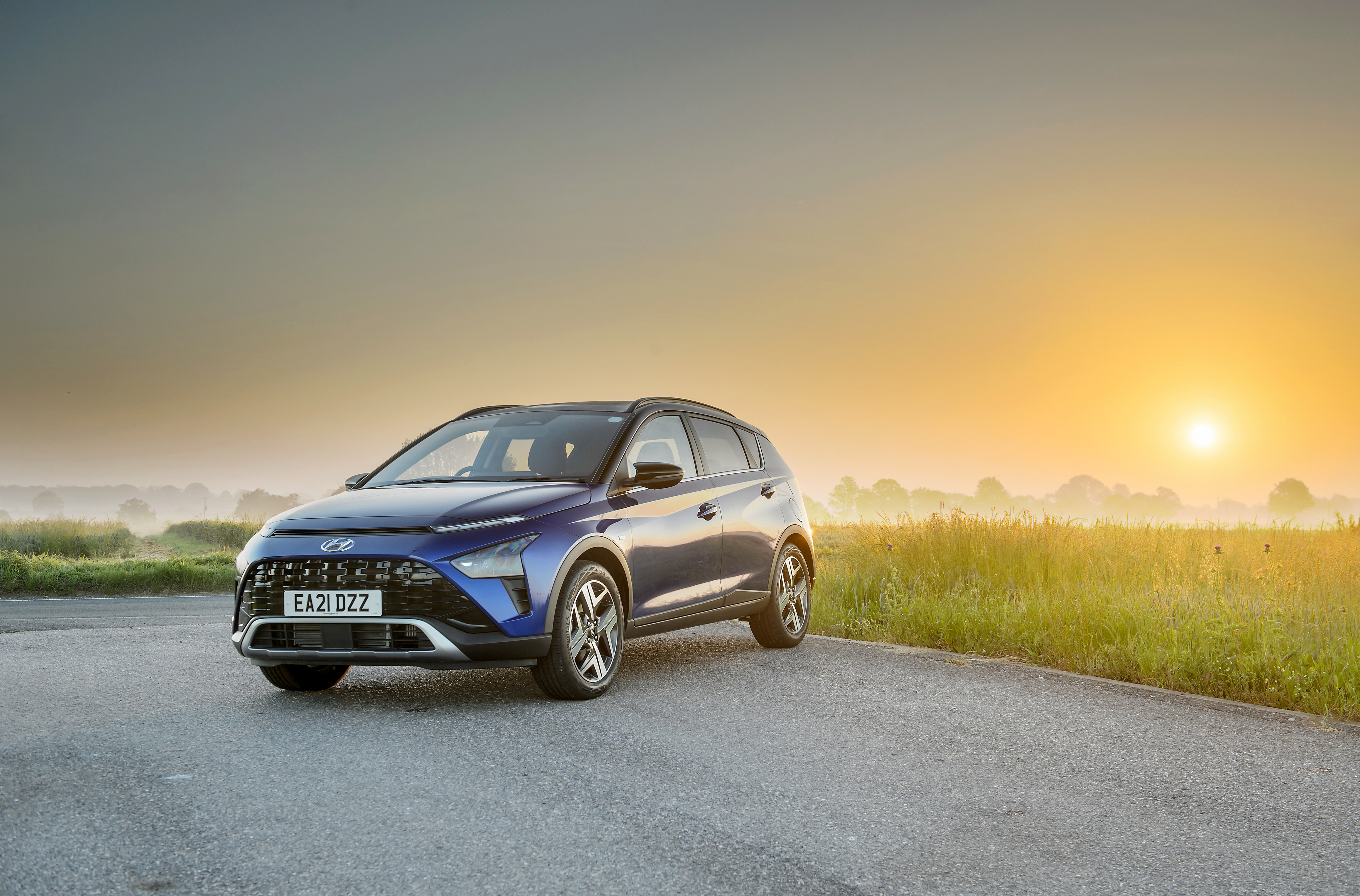 Blue 2021 Hyundai Bayon SUV at sunrise HD Wallpaper