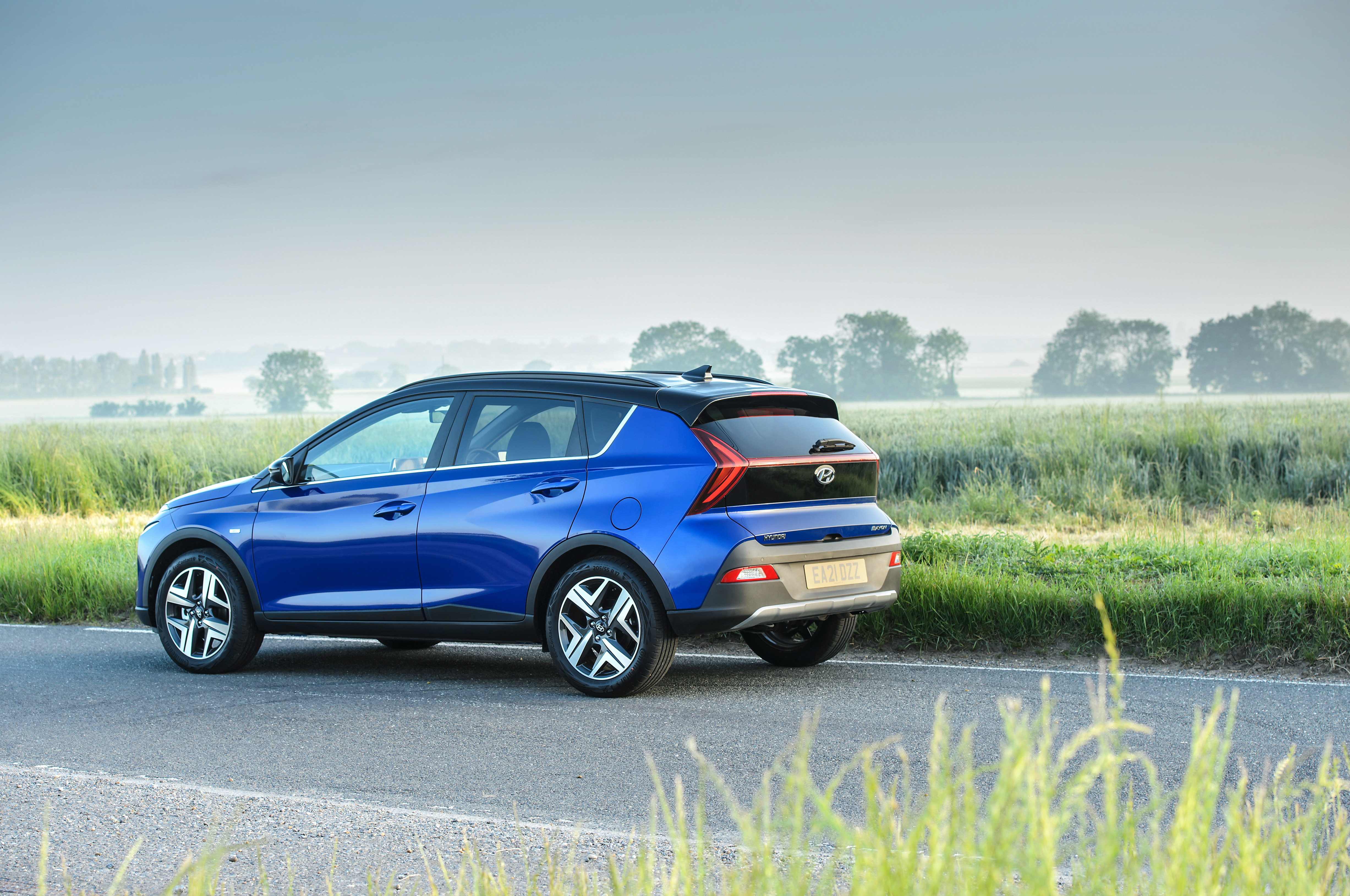 Blue 2021 Hyundai Bayon SUV on a country road HD Wallpaper