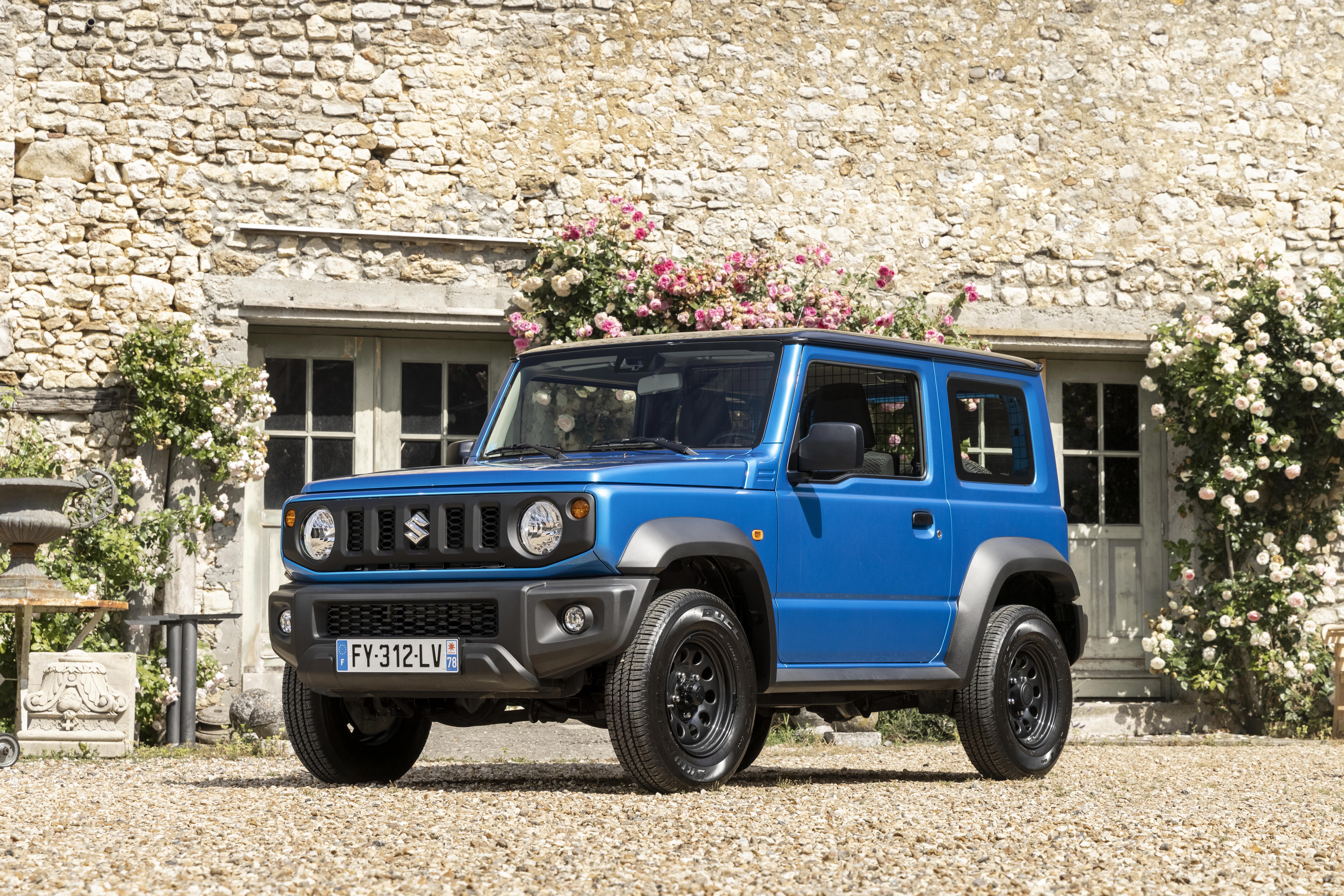 Blue 2021 Suzuki Jimny Commercial at a stone house HD Wallpaper
