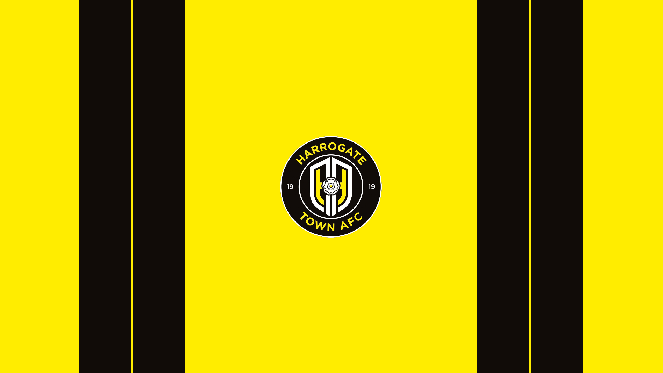 Harrogate Town AFC logo on yellow and black stripes HD Wallpaper