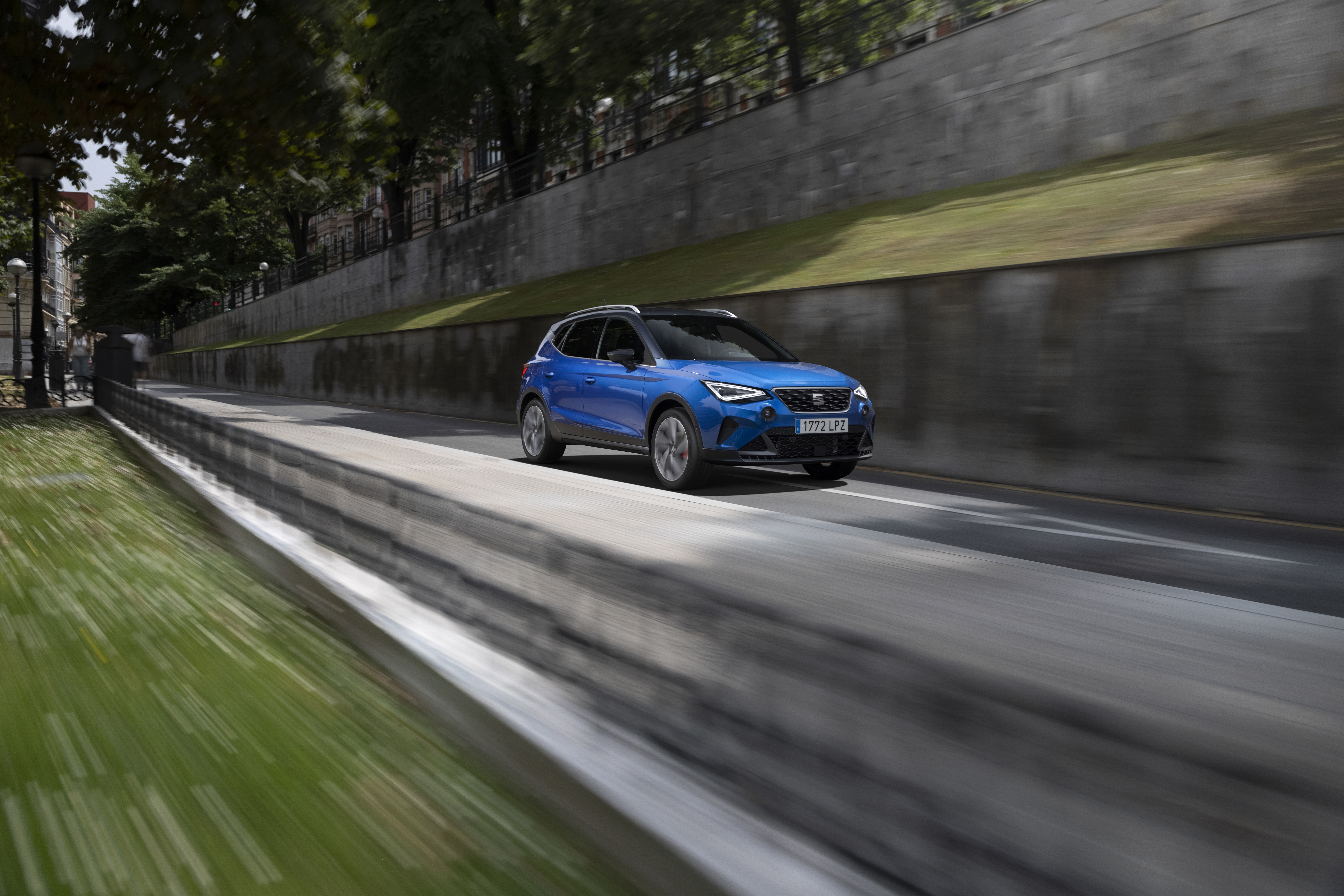 Blue 2021 SEAT Arona FR SUV driving on road HD Wallpaper