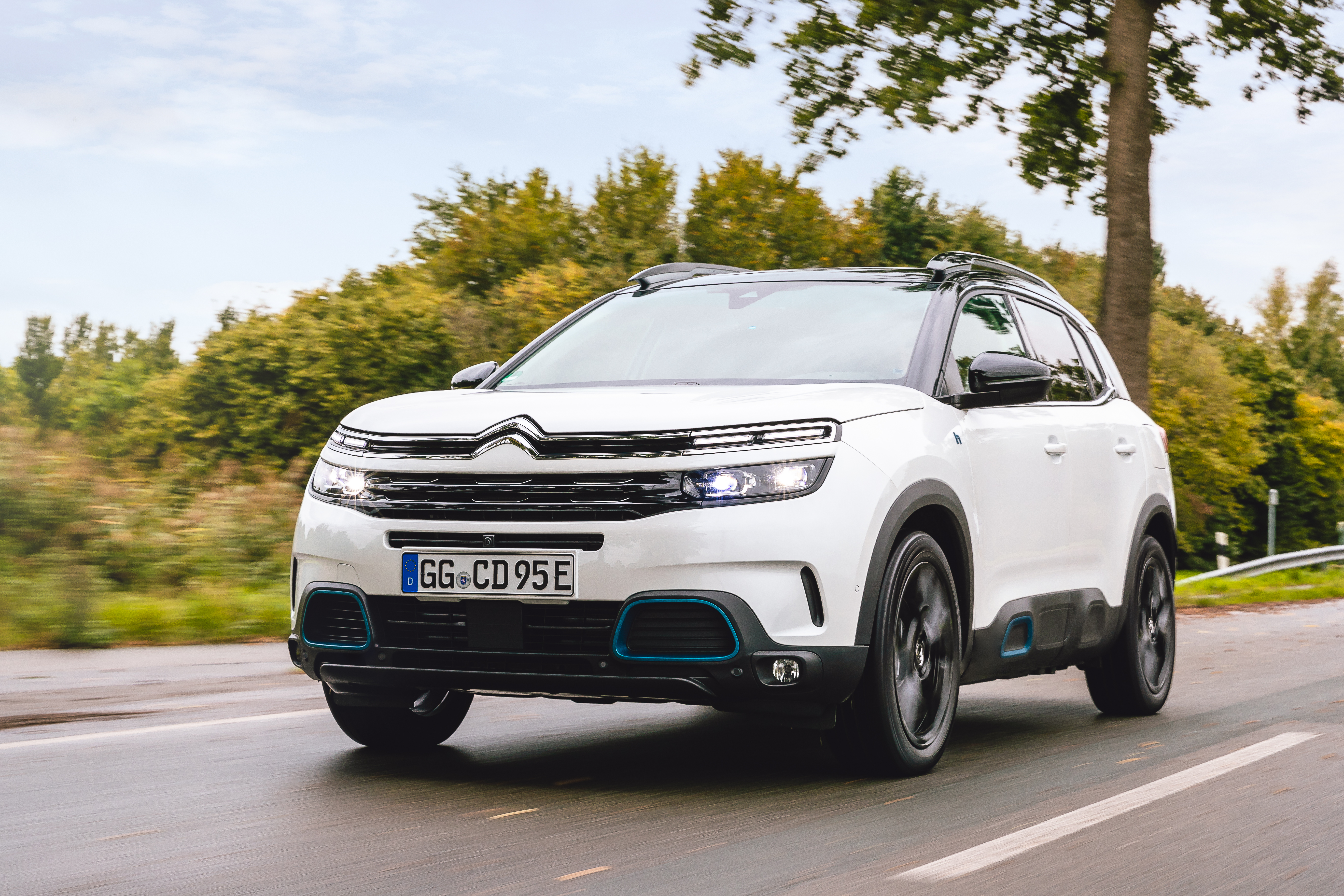 White Citroën C5 Aircross SUV Hybrid driving on a road HD Wallpaper