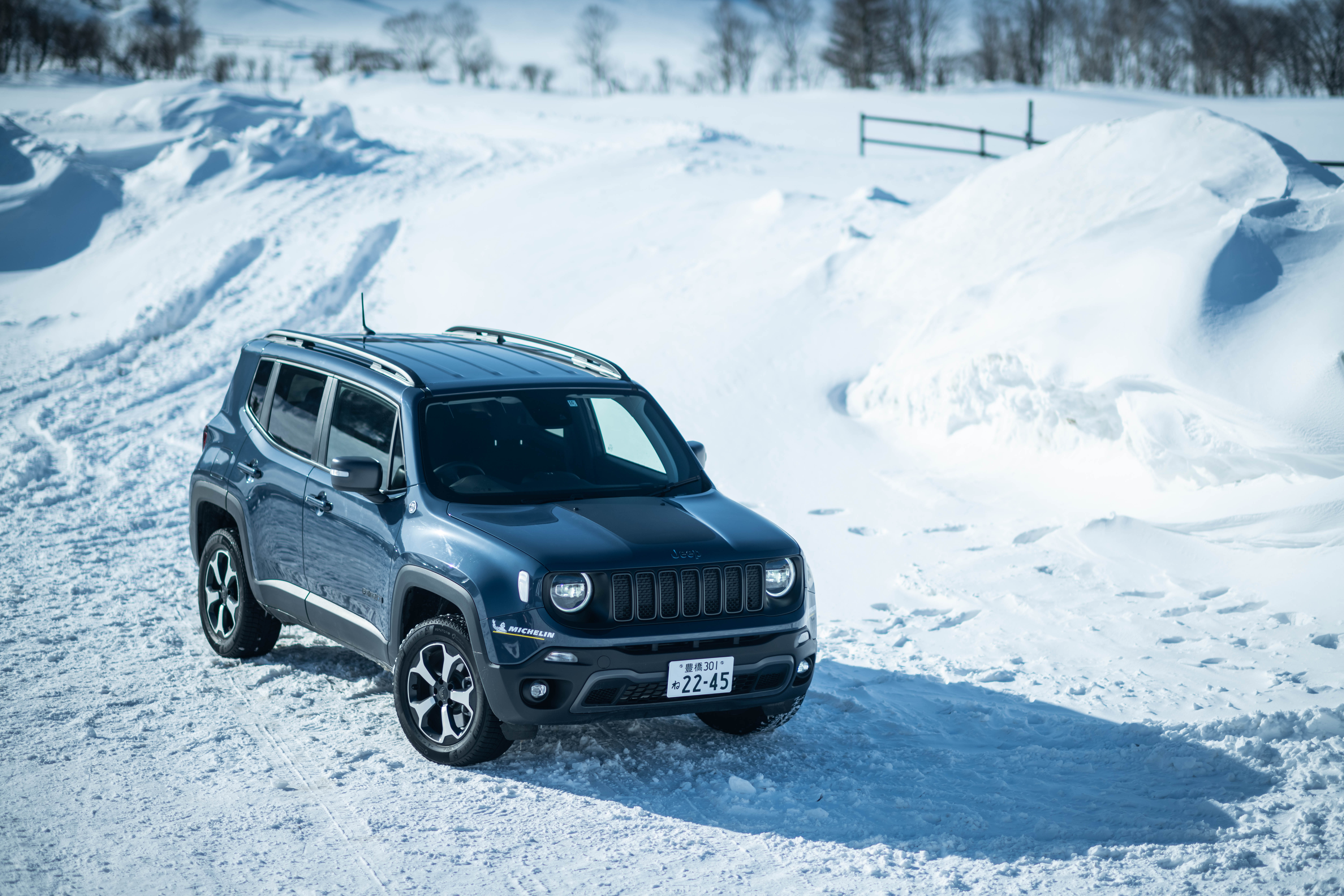 Jeep Renegade Trailhawk 4xe in snowy landscape HD Wallpaper