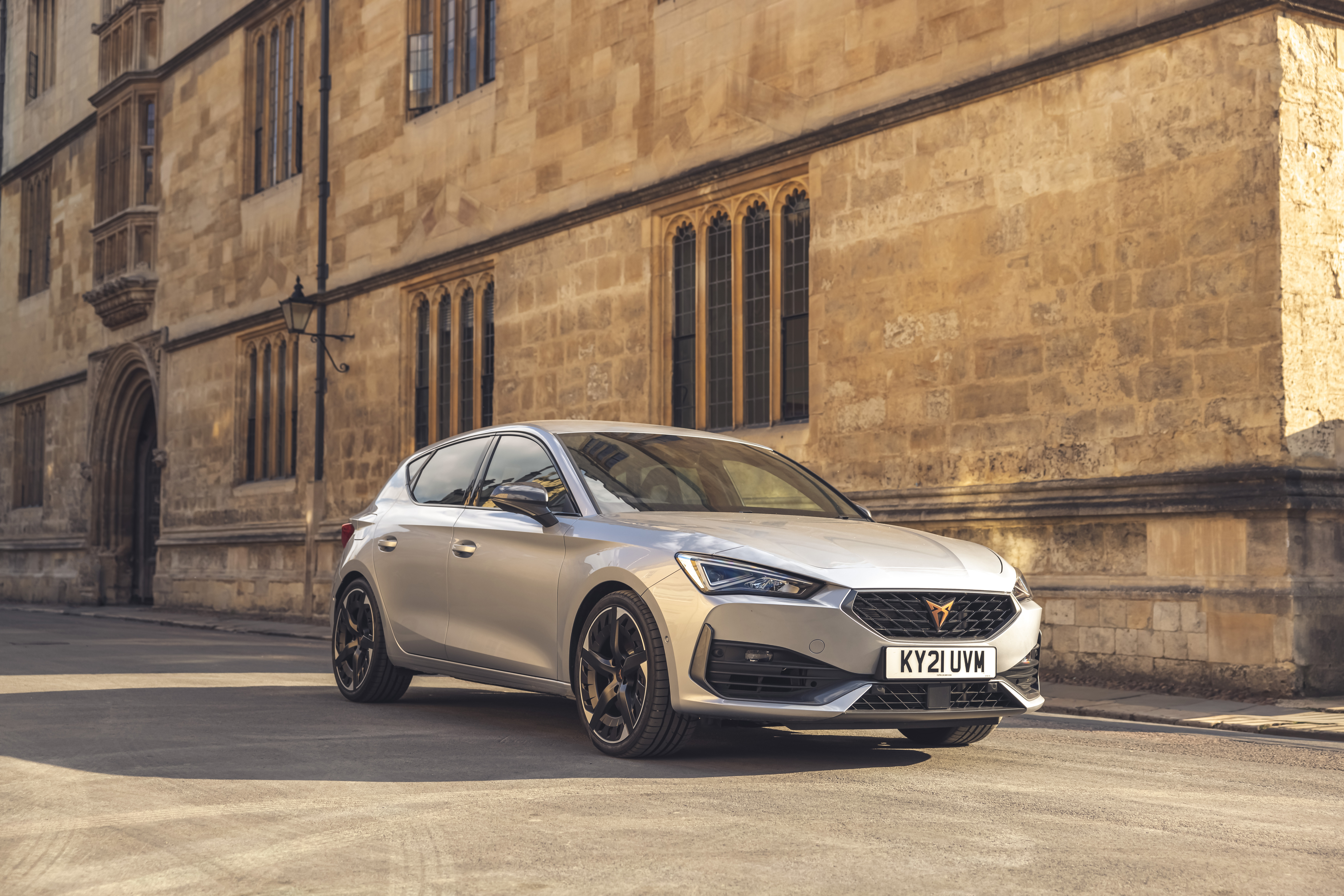 Silver 2021 Cupra Leon VZ3 parked outside building HD Wallpaper
