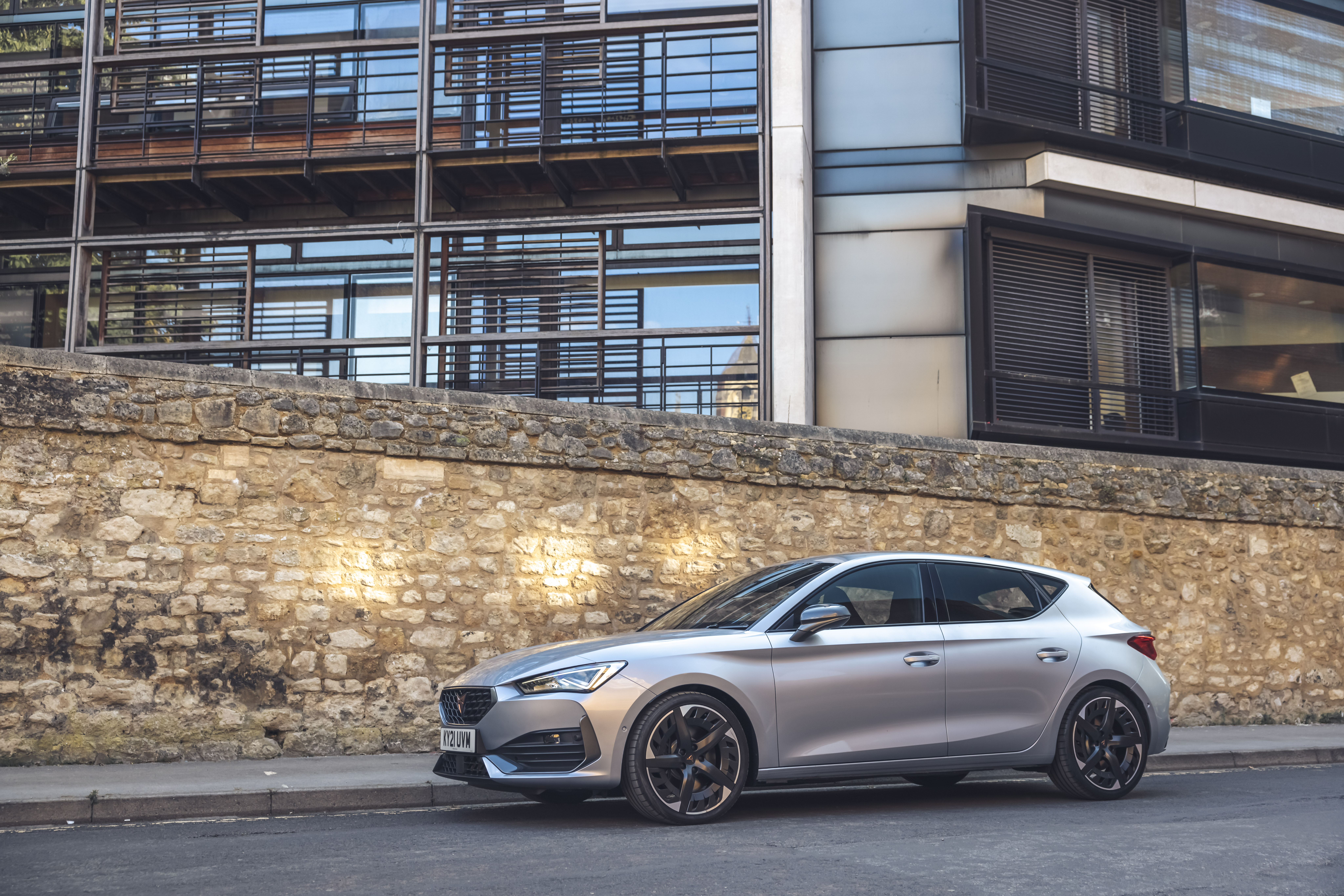 Silver 2021 Cupra Leon VZ3 parked by a stone wall HD Wallpaper