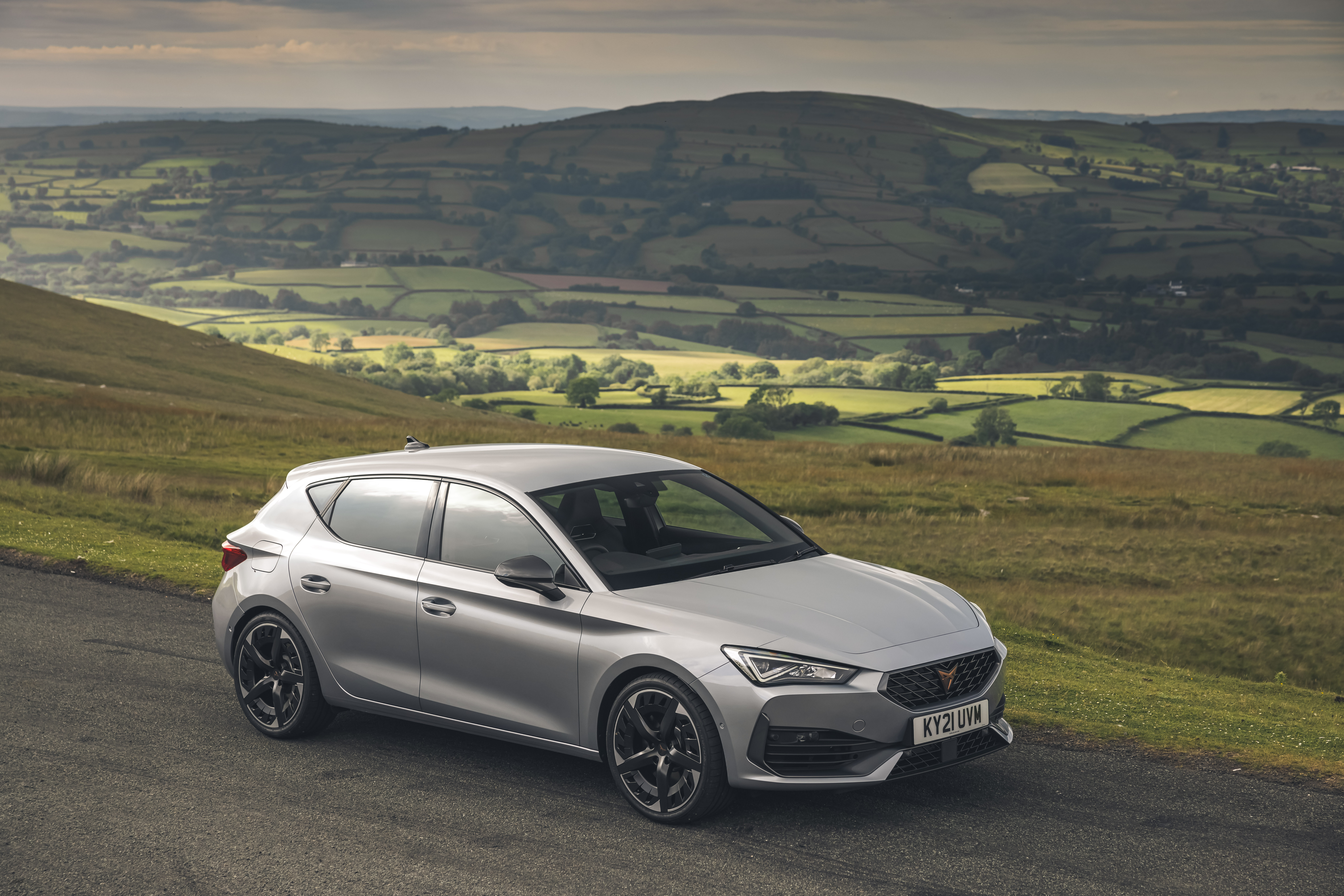 Silver 2021 Cupra Leon VZ3 on a scenic road HD Wallpaper