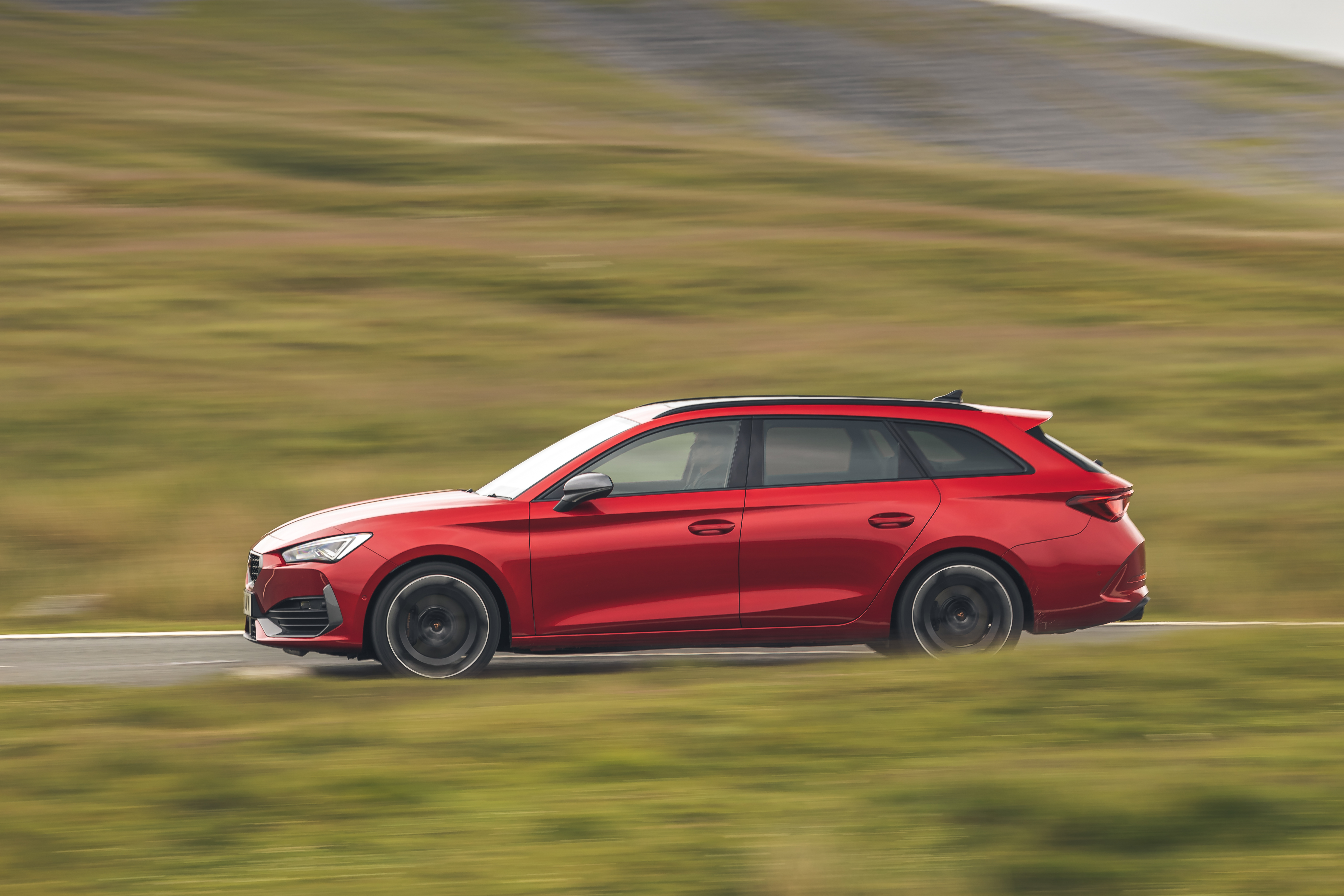Red Cupra Leon 4Drive VZ3 Estate driving on road HD Wallpaper