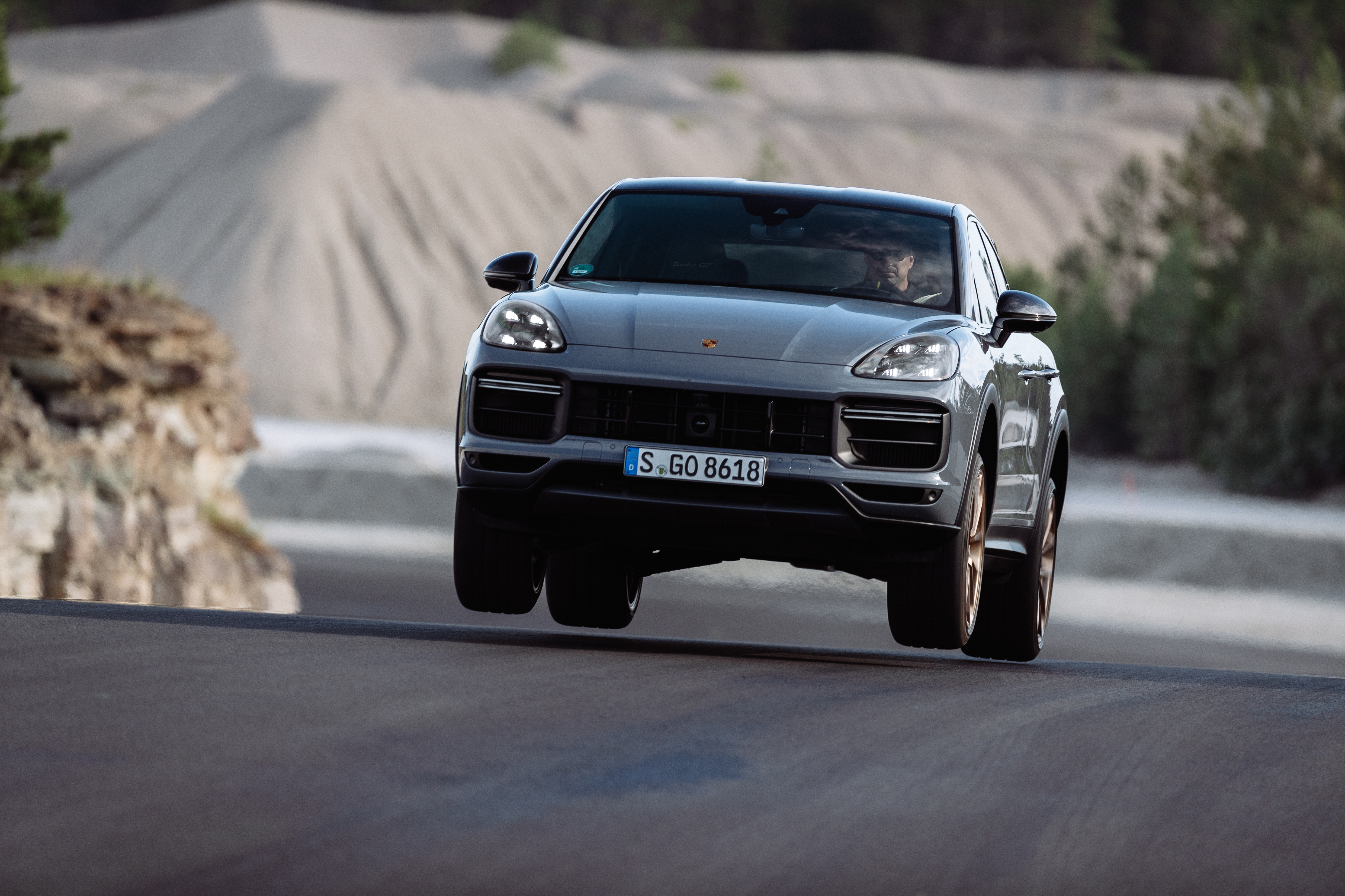2021 Porsche Cayenne Turbo GT driving on a road HD Wallpaper
