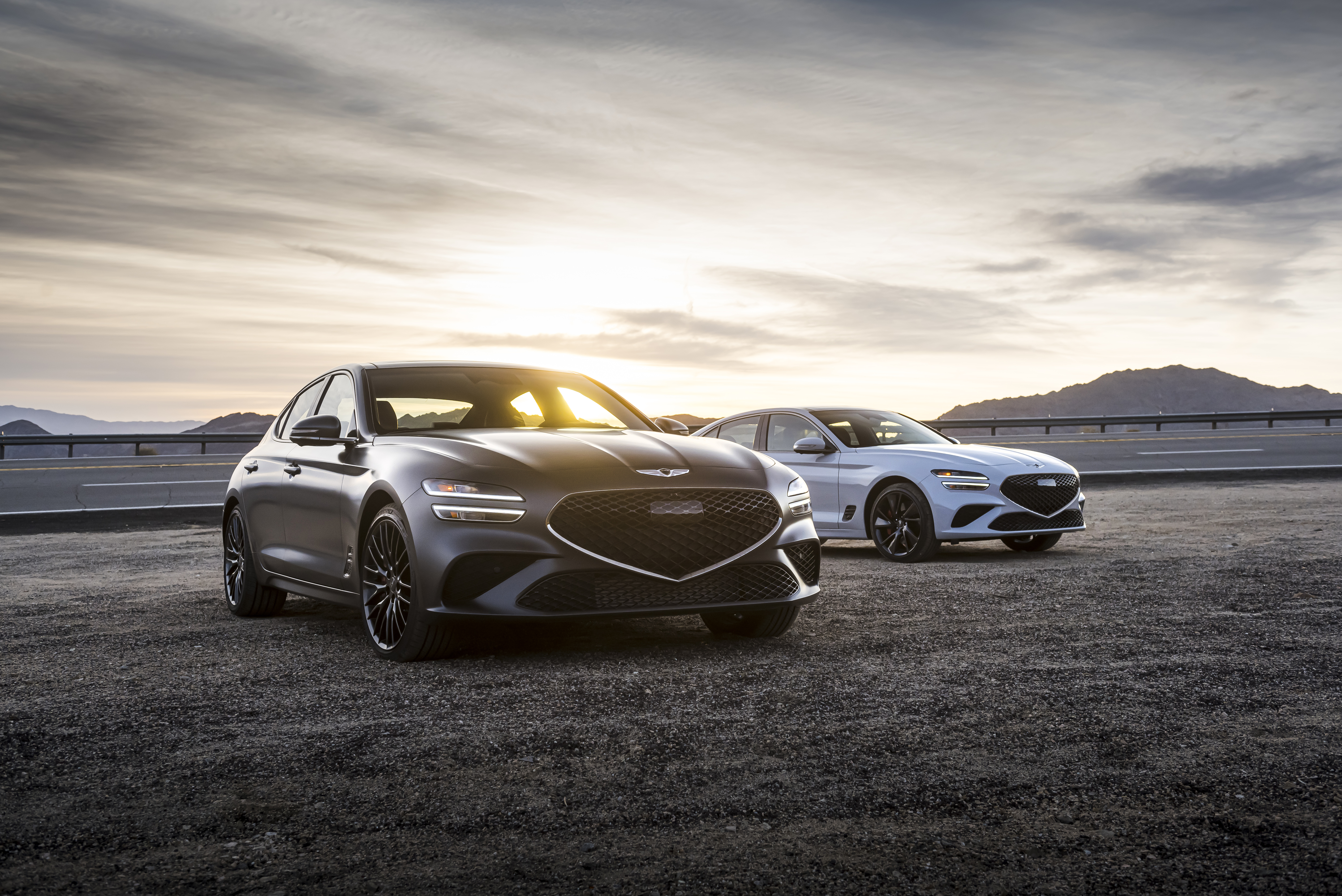 Genesis G70 luxury cars on a road at sunset HD Wallpaper