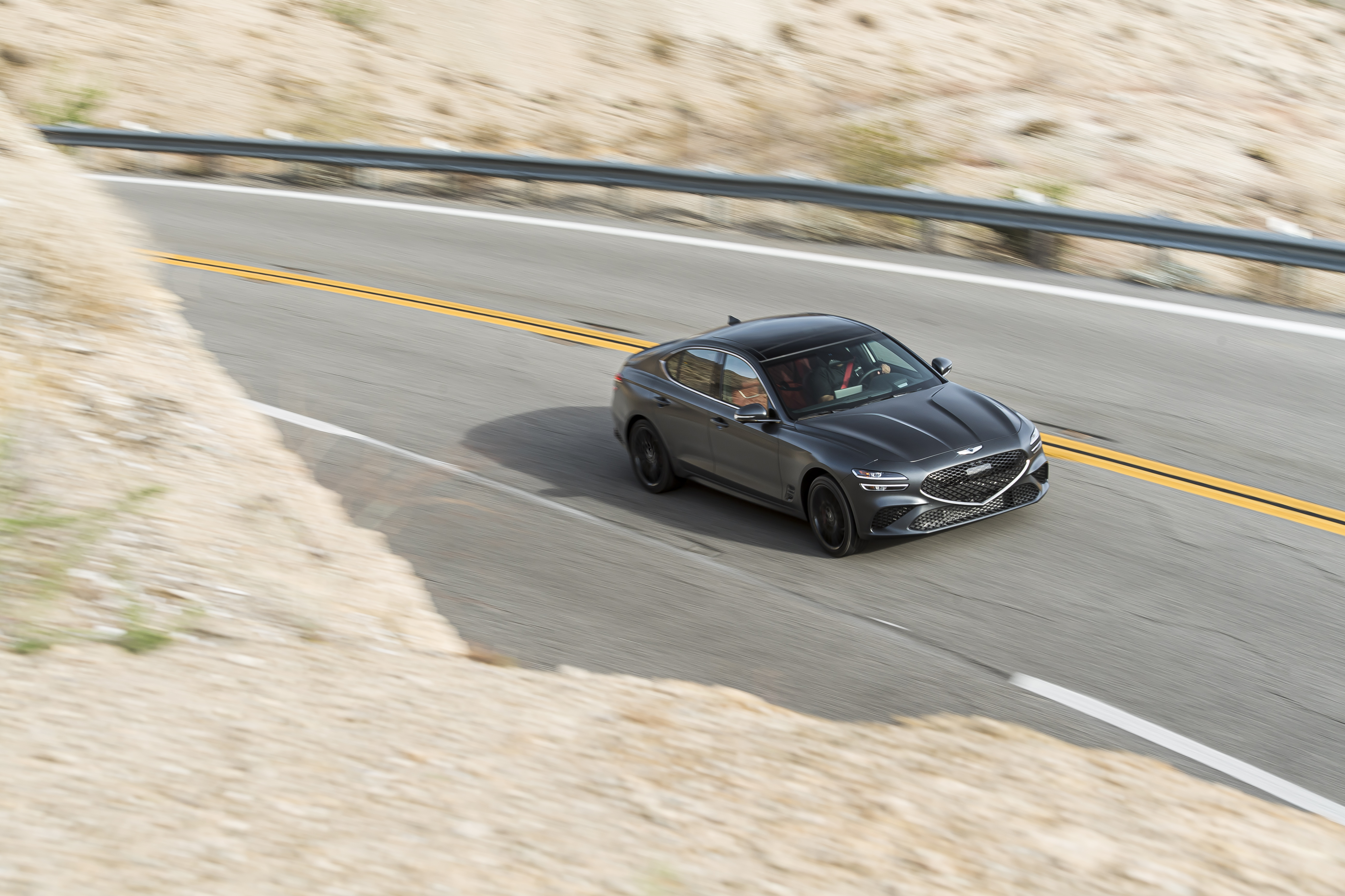 Grey 2022 Genesis G70 3.3T AWD on winding road HD Wallpaper