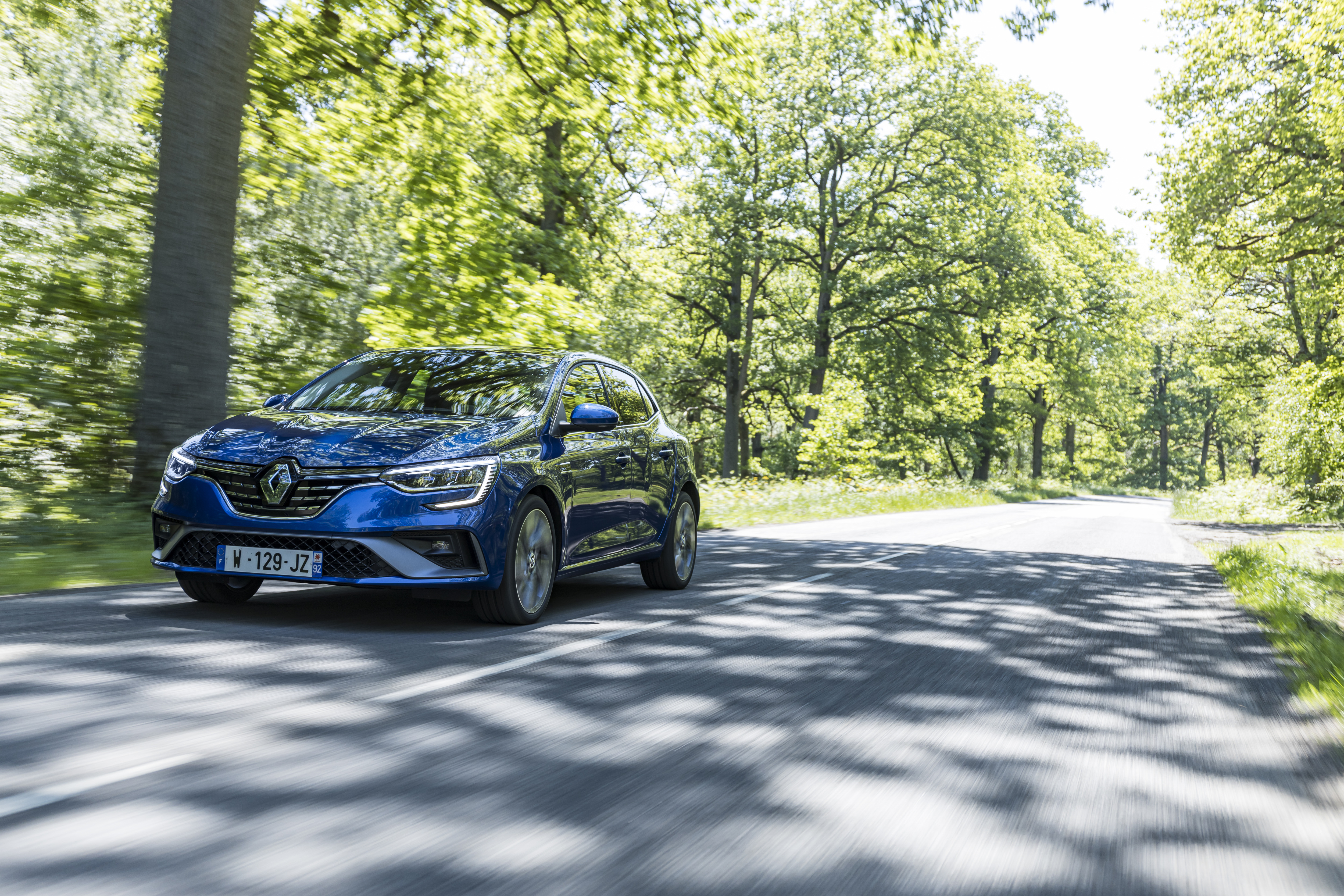 Blue 2021 Renault Mégane E-TECH driving on a sunny road HD Wallpaper