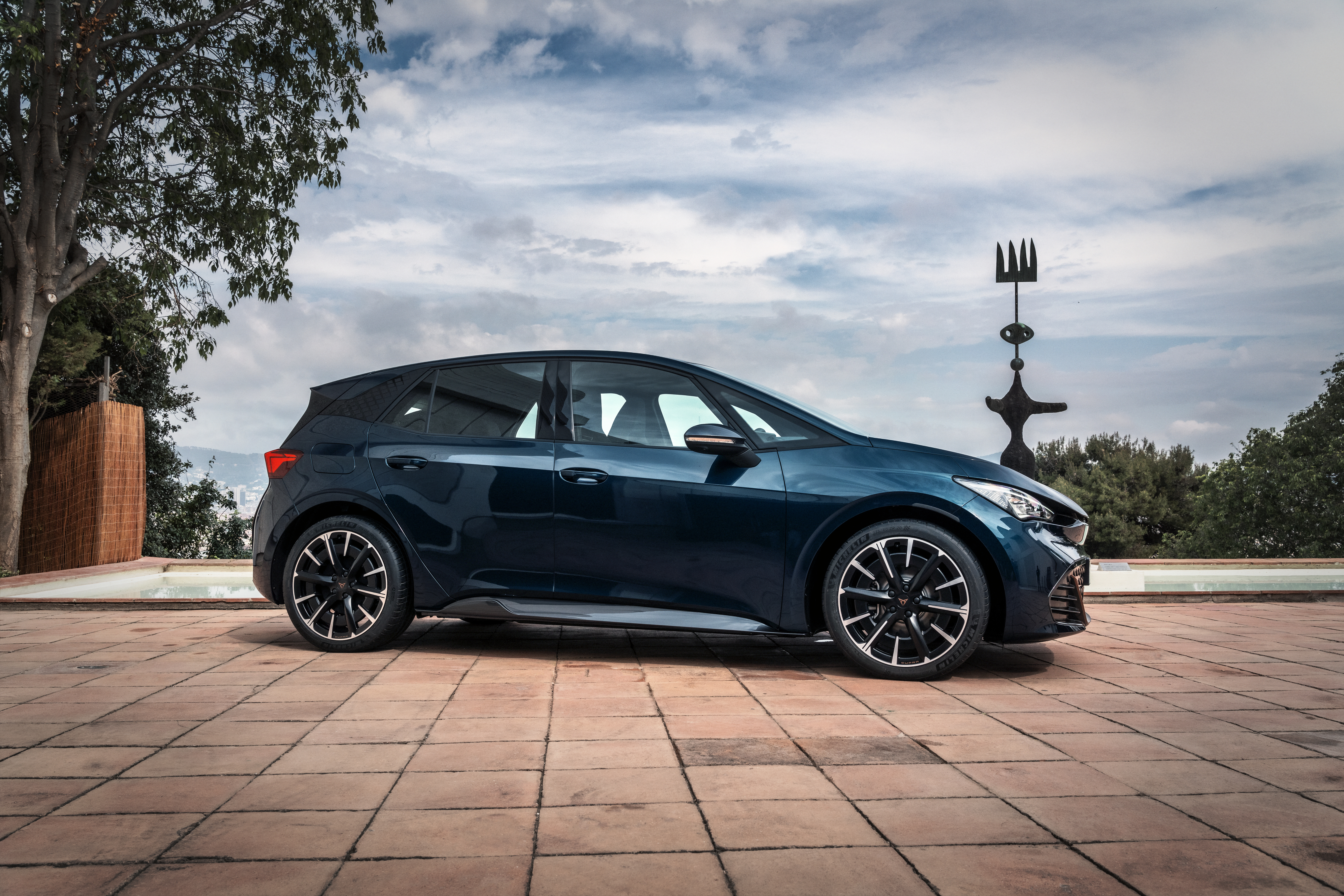 Blue 2021 Cupra Born electric car parked outdoors HD Wallpaper