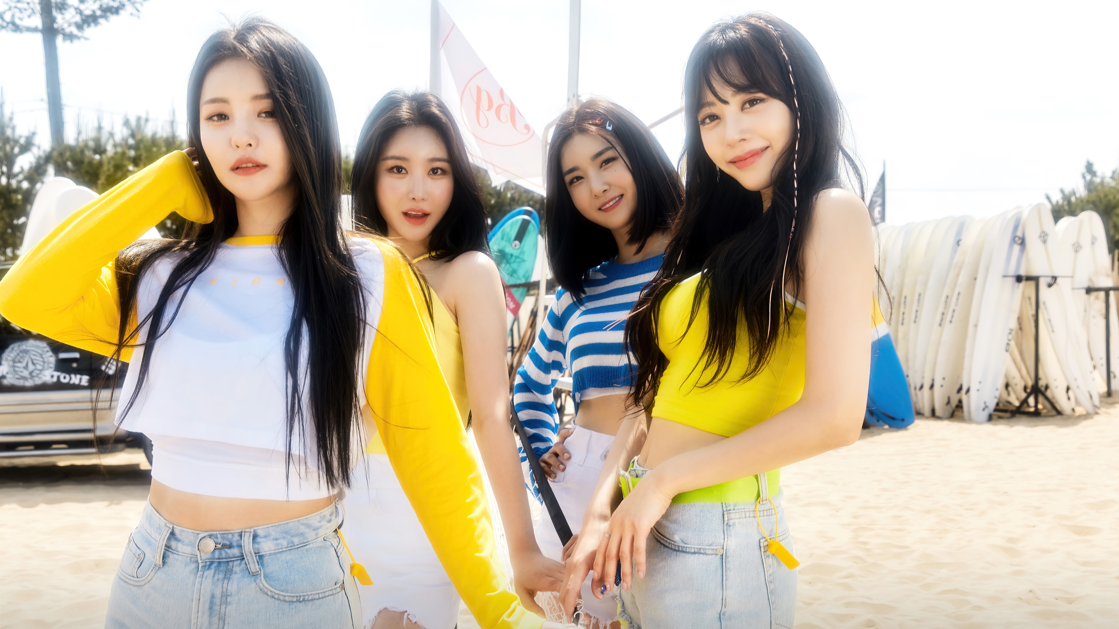 Brave Girls members on a beach with surfboards HD Wallpaper