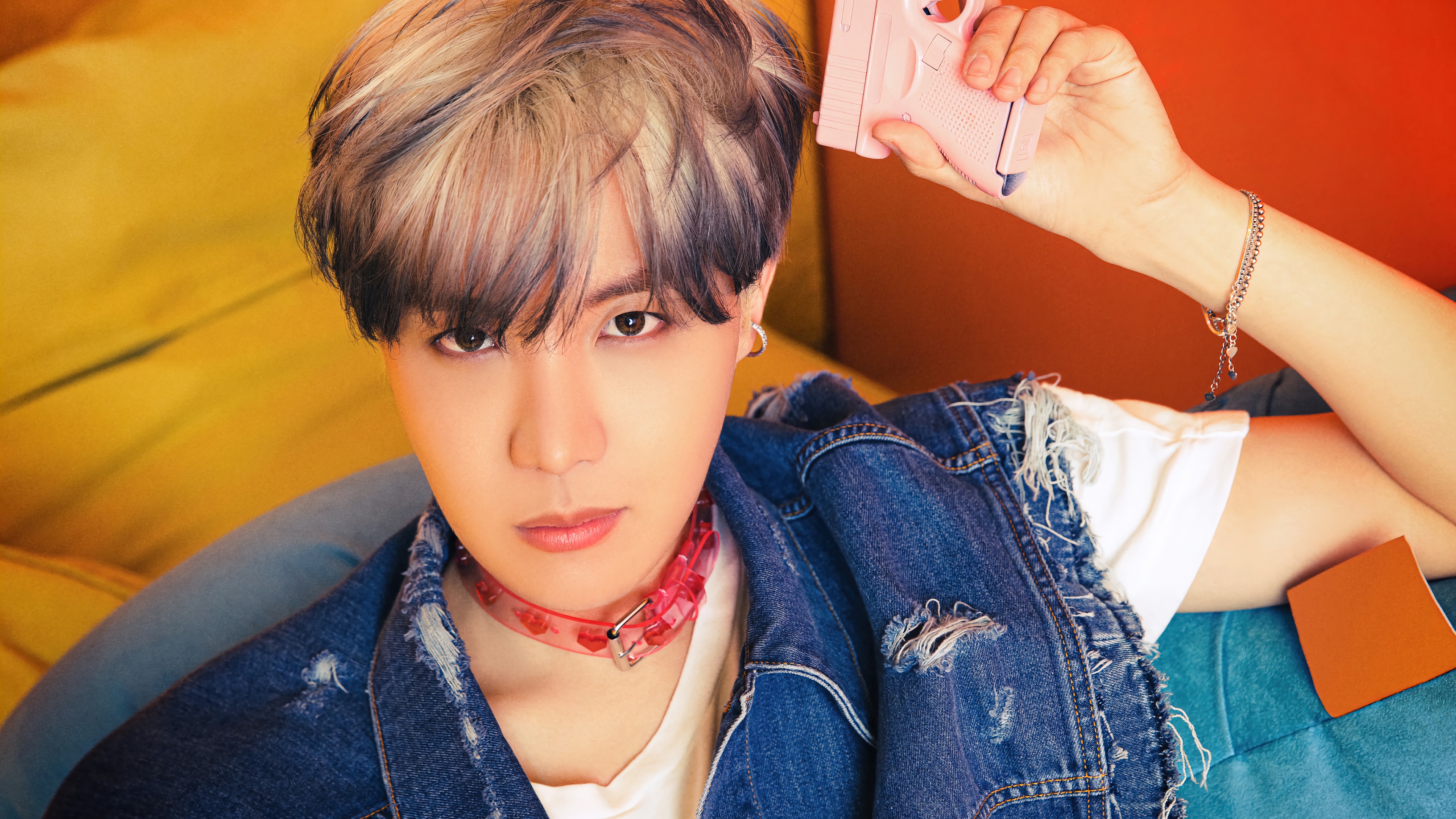 J-Hope from BTS holding a pink toy gun HD Wallpaper