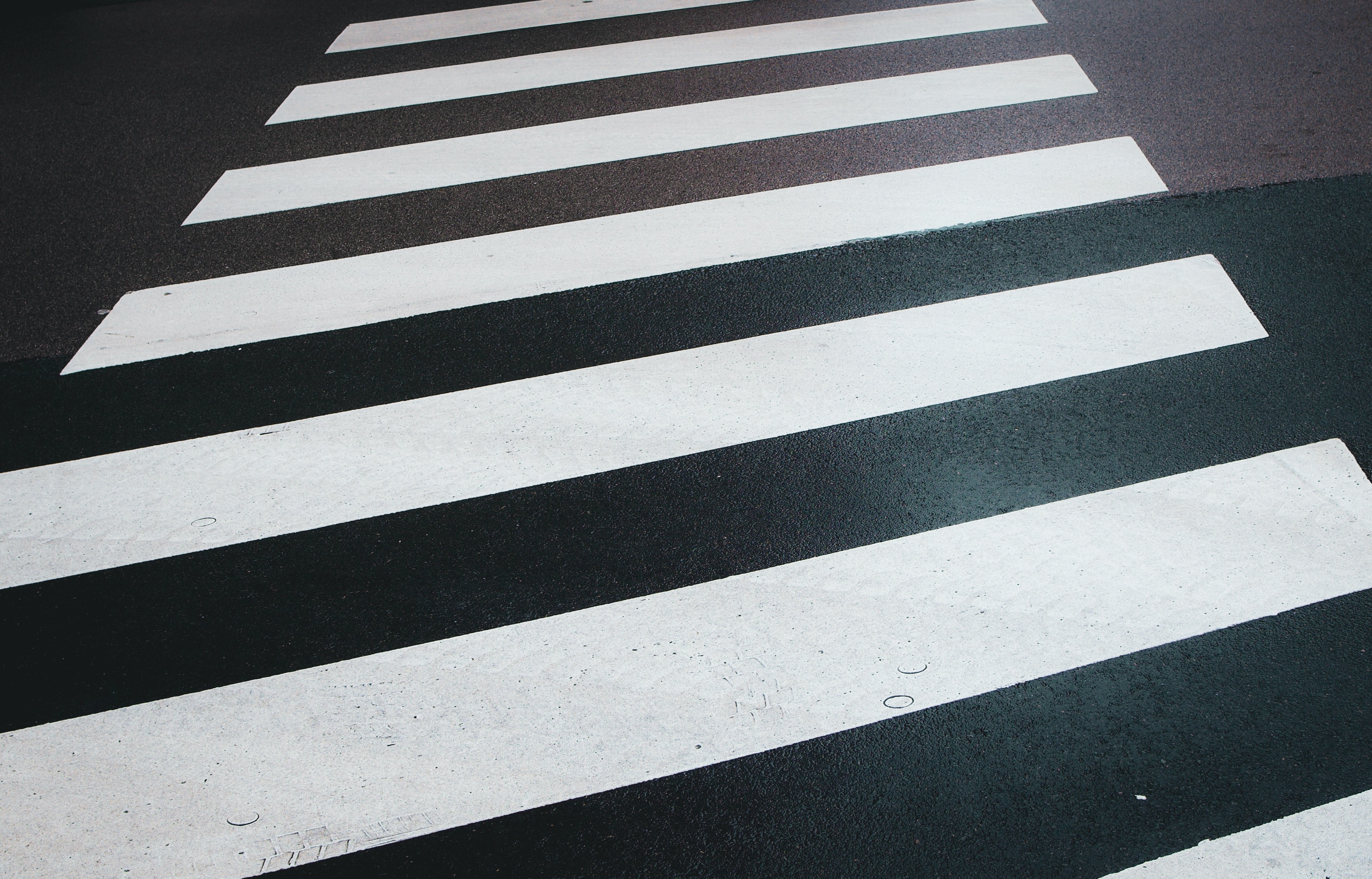 High definition crosswalk on asphalt road HD Wallpaper