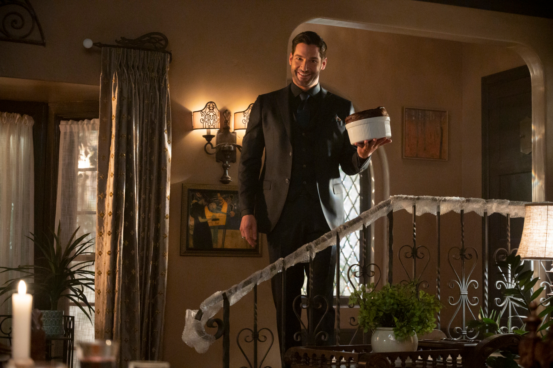 Lucifer Morningstar holding a dessert on stairs HD Wallpaper