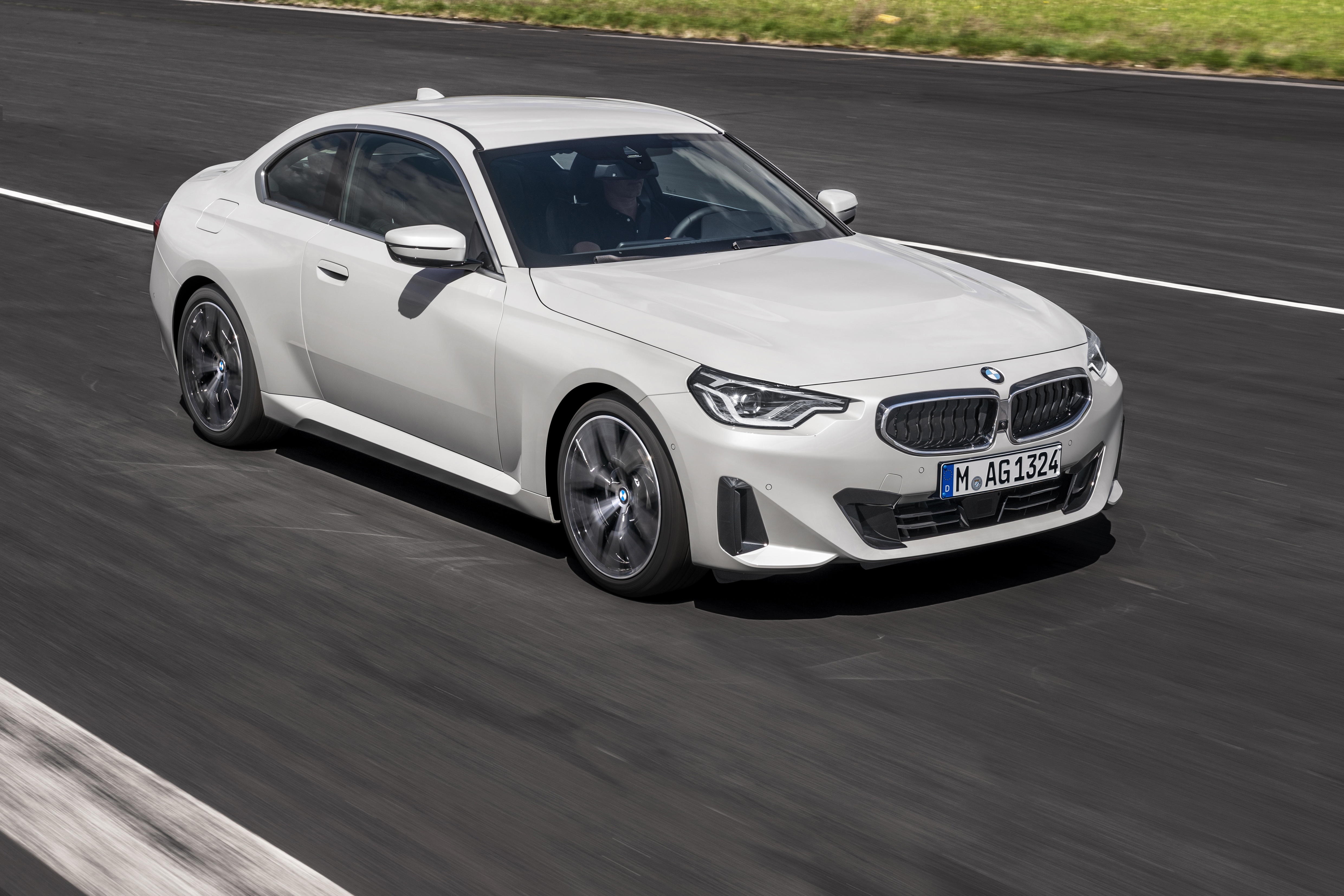 White BMW 220i Coupe driving on a track HD Wallpaper