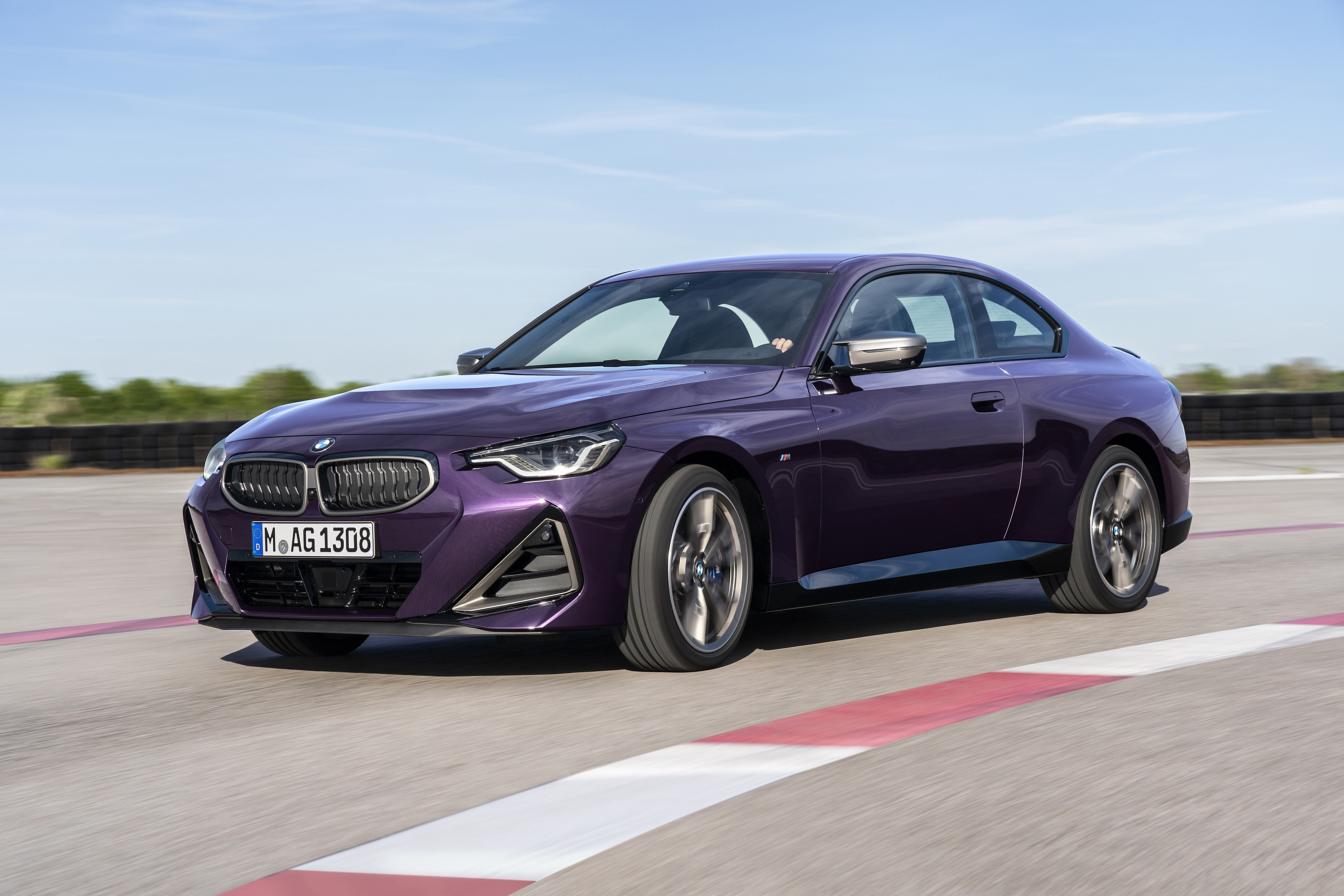 Purple BMW M240i xDrive Coupé on a Racetrack HD Wallpaper
