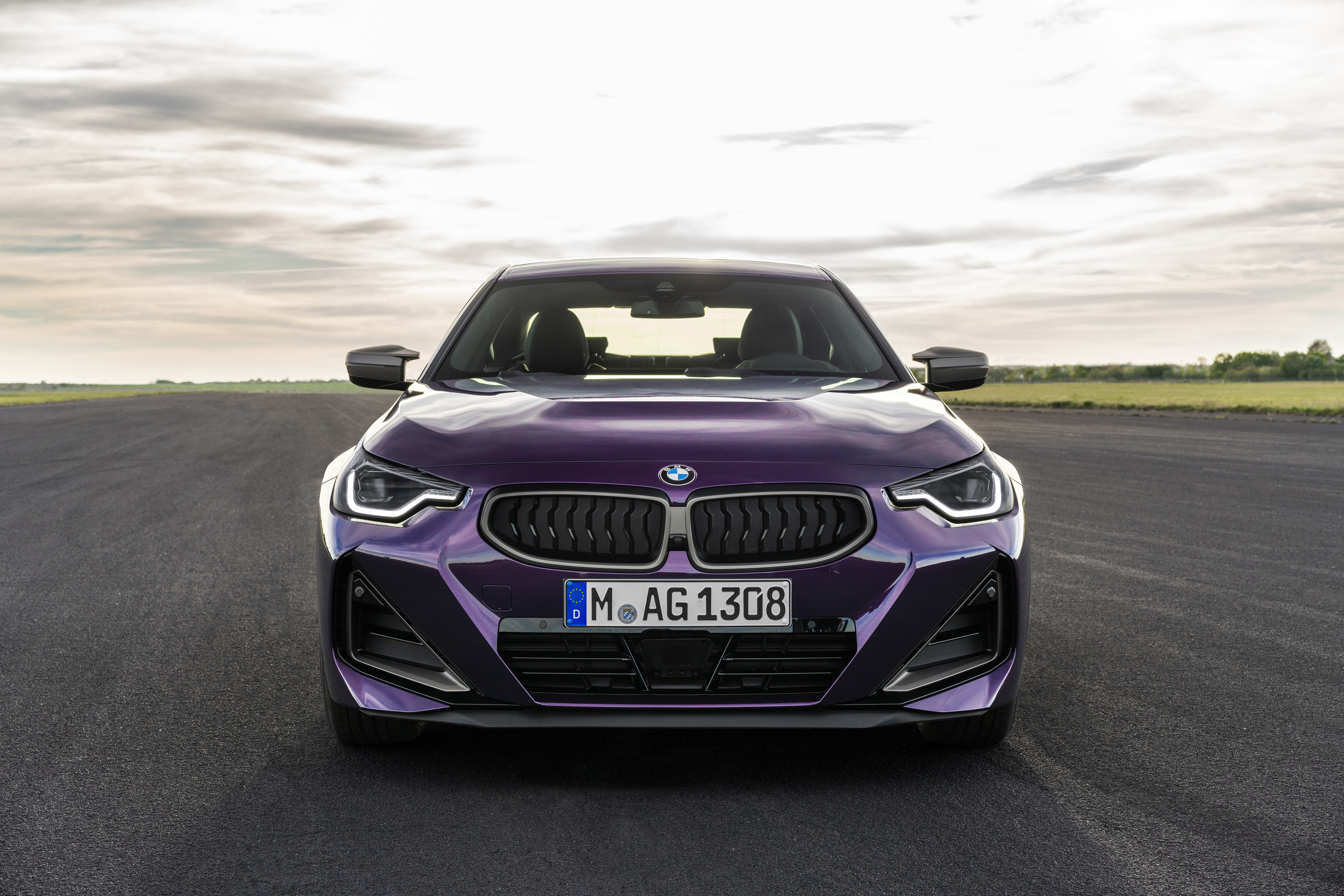 Purple BMW M240i xDrive Coupé on a Racetrack HD Wallpaper